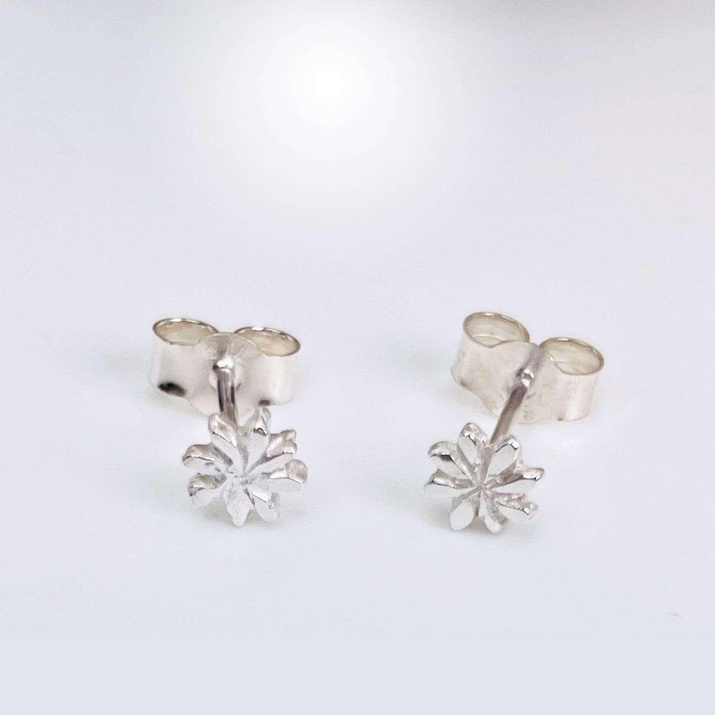 The Expanded Skies Dartmoor Daisy Studs are inspired by the daisies that speckle meadows of the lowland moor and waysides, bringing lightness and joy to the walker.