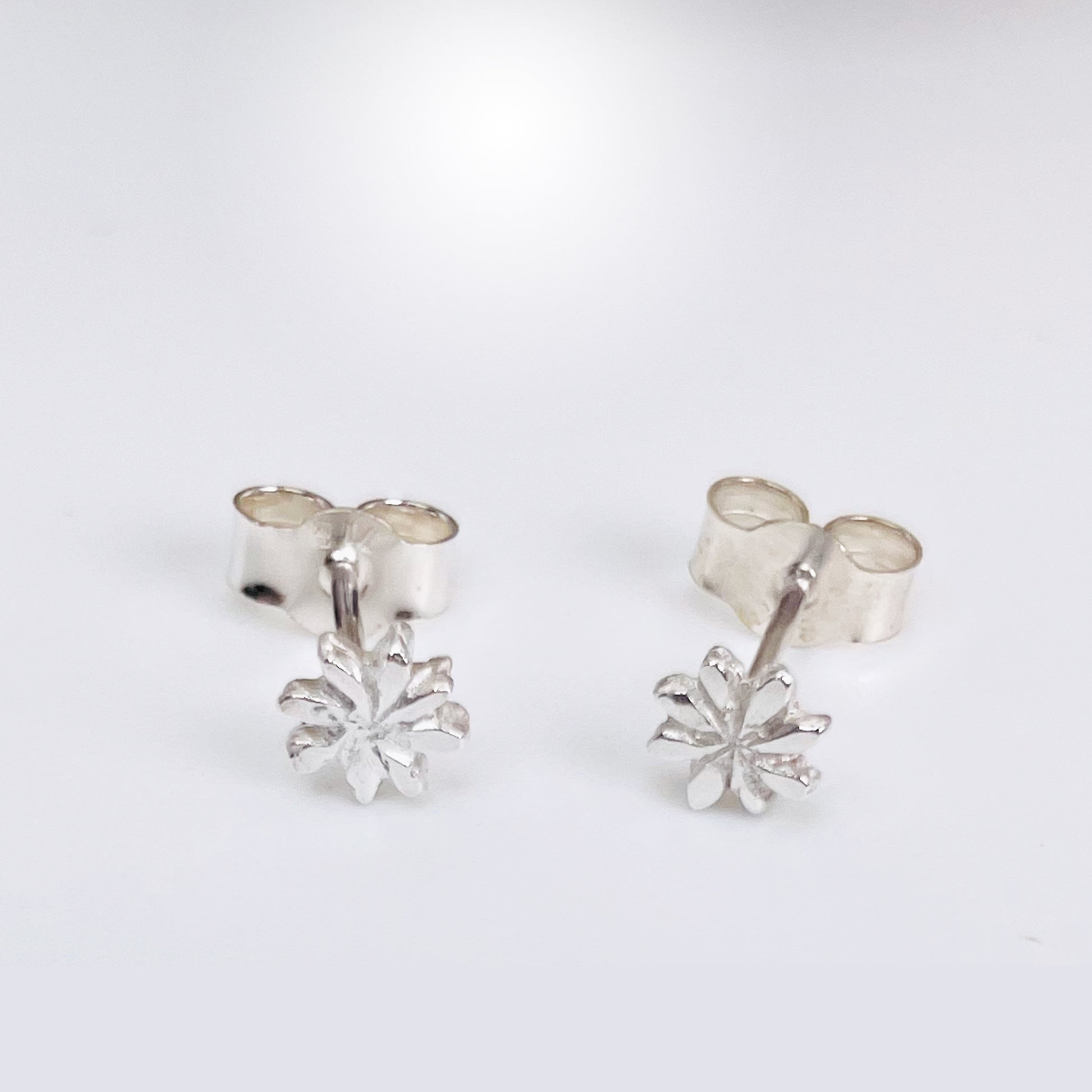 The Expanded Skies Dartmoor Daisy Studs are inspired by the daisies that speckle meadows of the lowland moor and waysides, bringing lightness and joy to the walker.