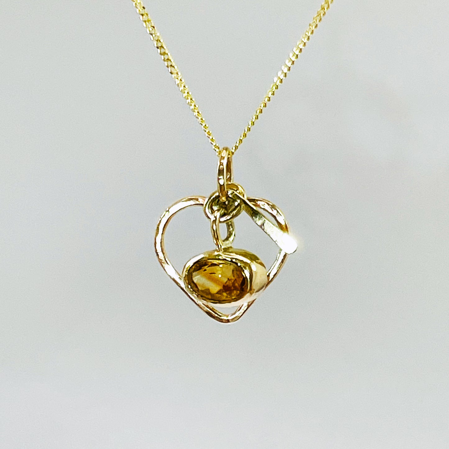 The Expanded Skies Joyful Heart Pendant has a beautiful faceted burnt citrine set in 9ct gold bezel on a 9ct gold heart. Totally handcrafted on the edge of Dartmoor and made from high quality recycled gold. Understated and beautiful, it can be worn every day or for special occasions.