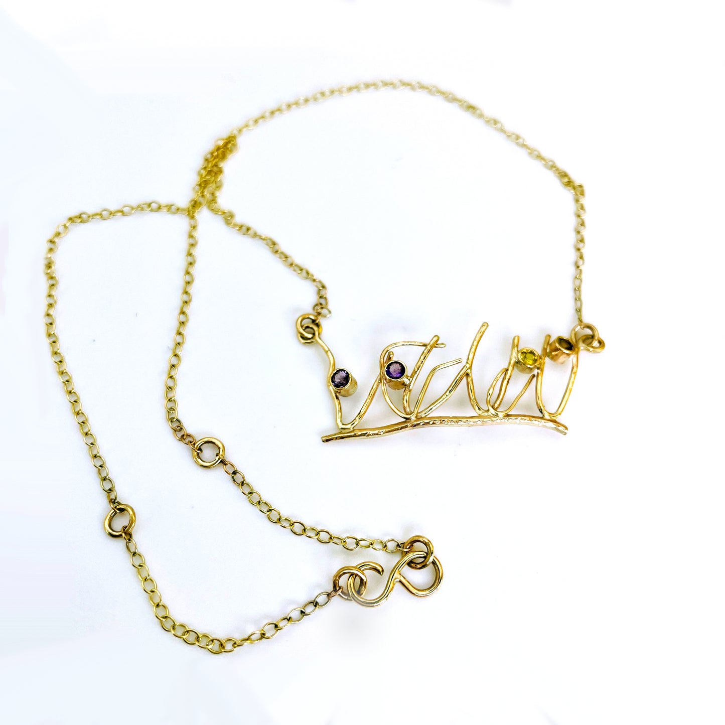 The Expanded Skies Dartmoor Heather and Gorse Necklace evokes the beautiful yellows of the gorse and purples of the heather with two ethically sourced yellow sapphires and two amethysts from Nineteen48 Ltd held in twisting branches of 9ct yellow gold. The chain can be worn at two different lengths, the shorter with a back drop.
This handcrafted unique, one-off, piece makes a wonderful gift, celebrating the evocative and joyful colours of Dartmoor.