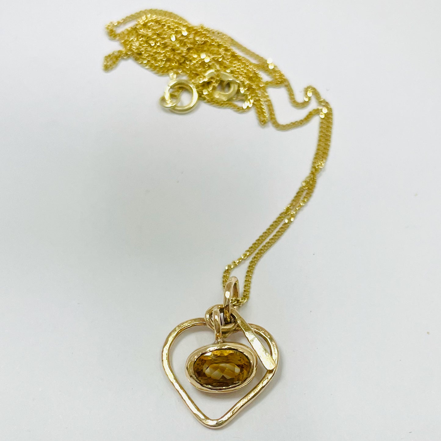The Expanded Skies Joyful Heart Pendant has a beautiful faceted burnt citrine set in 9ct gold bezel on a 9ct gold heart. Totally handcrafted on the edge of Dartmoor and made from high quality recycled gold. Understated and beautiful, it can be worn every day or for special occasions.