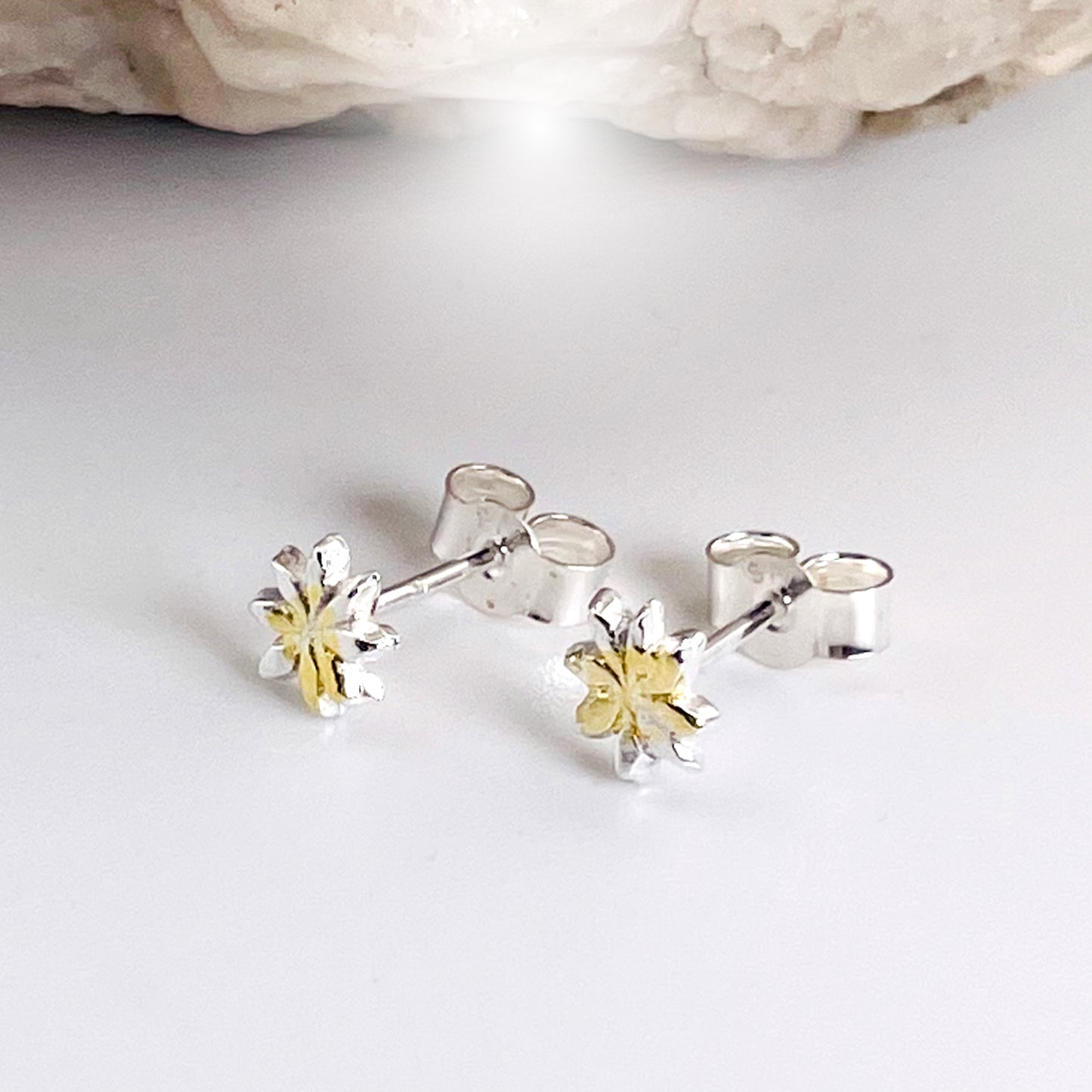 The Dartmoor Daisy Studs are inspired by the sea of daisies that speckle meadows of the lowland moor and waysides, bringing lightness and joy to the walker.