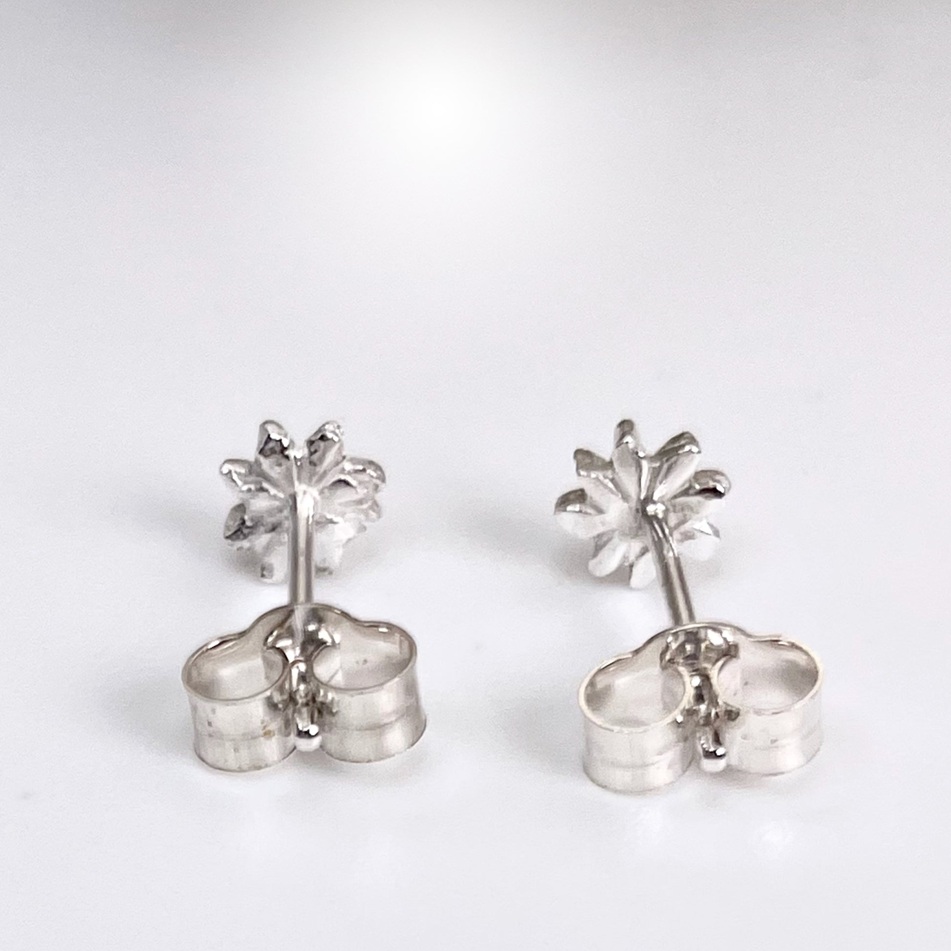 The Expanded Skies Dartmoor Daisy Studs are inspired by the daisies that speckle meadows of the lowland moor and waysides, bringing lightness and joy to the walker.