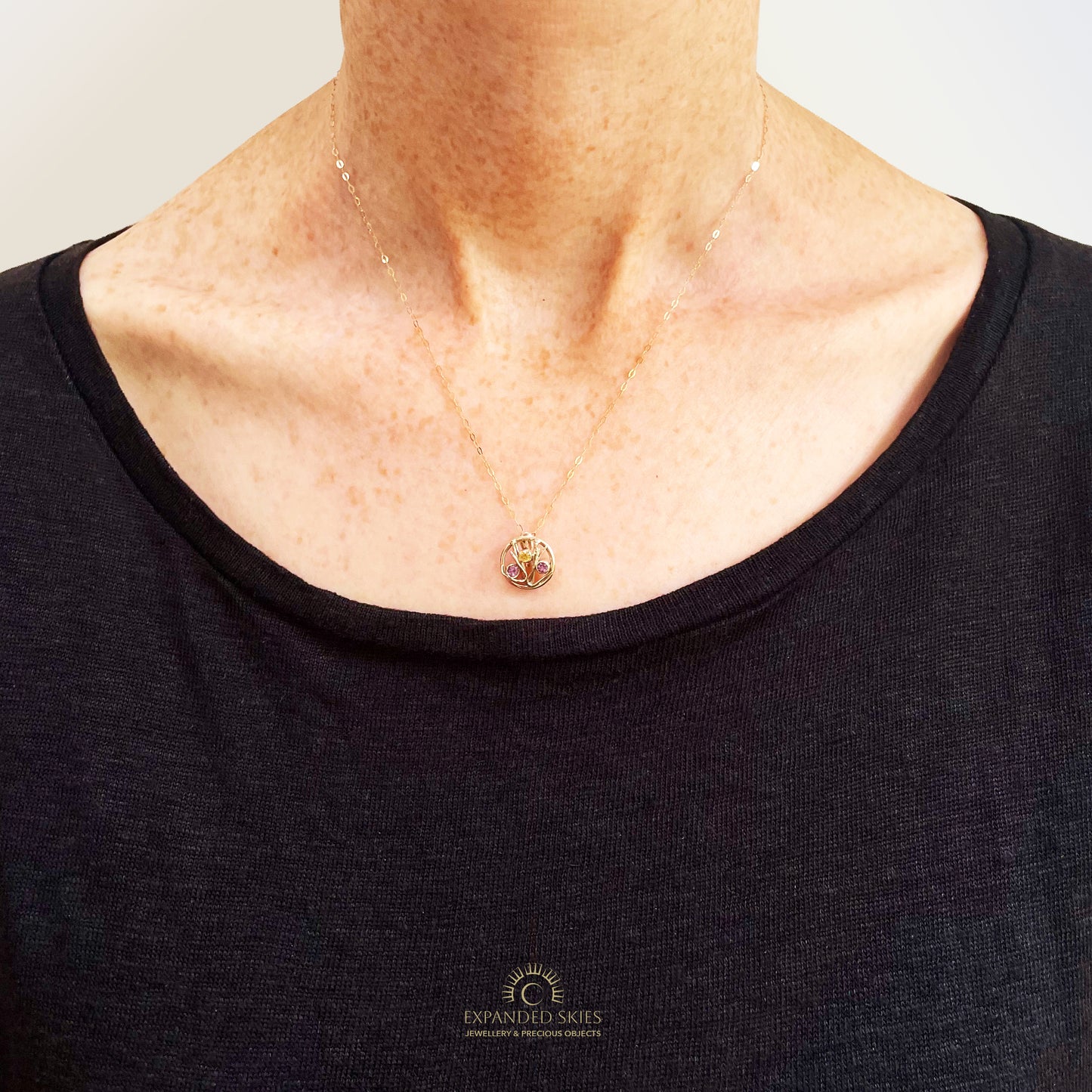 The Expanded Skies Dartmoor Heather and Gorse Pendant evokes the beautiful yellows of the gorse and purples of the heather with an ethically sourced yellow sapphire and two amethysts held in twisting branches of 9ct yellow gold. The pendant comes with a 9ct gold chain, a choice of lengths are available.
This handcrafted unique, one-off, piece makes a wonderful gift, celebrating the evocative and joyful colours of Dartmoor.