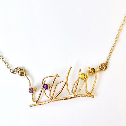 The Expanded Skies Dartmoor Heather and Gorse Necklace evokes the beautiful yellows of the gorse and purples of the heather with two ethically sourced yellow sapphires and two amethysts from Nineteen48 Ltd held in twisting branches of 9ct yellow gold. The chain can be worn at two different lengths, the shorter with a back drop.
This handcrafted unique, one-off, piece makes a wonderful gift, celebrating the evocative and joyful colours of Dartmoor.