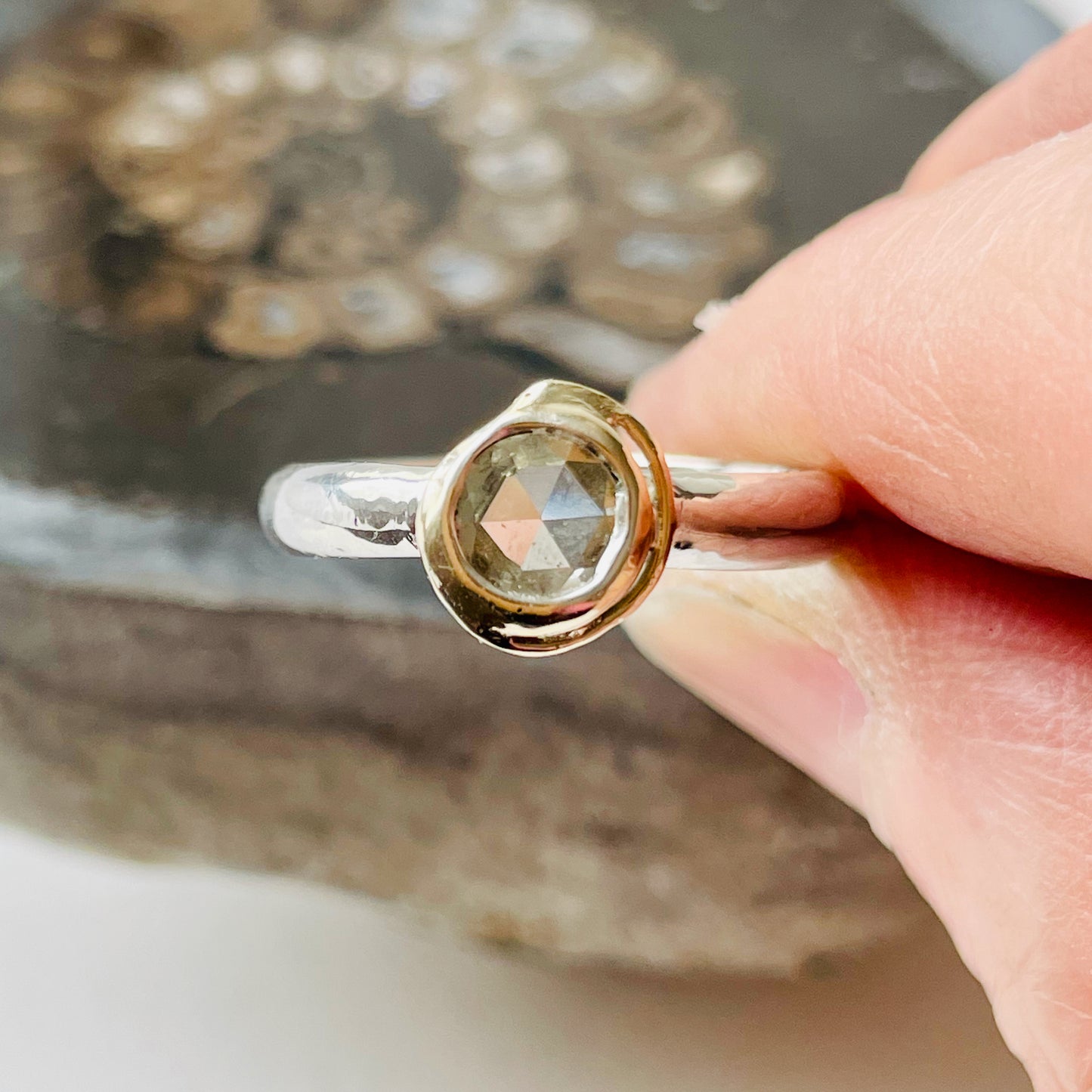 Haytor Quarry Pool White Sapphire Ring has a beautiful ethically sourced Sri Lankan faceted white 5mm sapphire, set in 9ct gold, on sterling silver band. Completely handcrafted from high quality recycled sterling silver and recycled gold. Understated and beautiful, it can be worn every day and for special occasions.