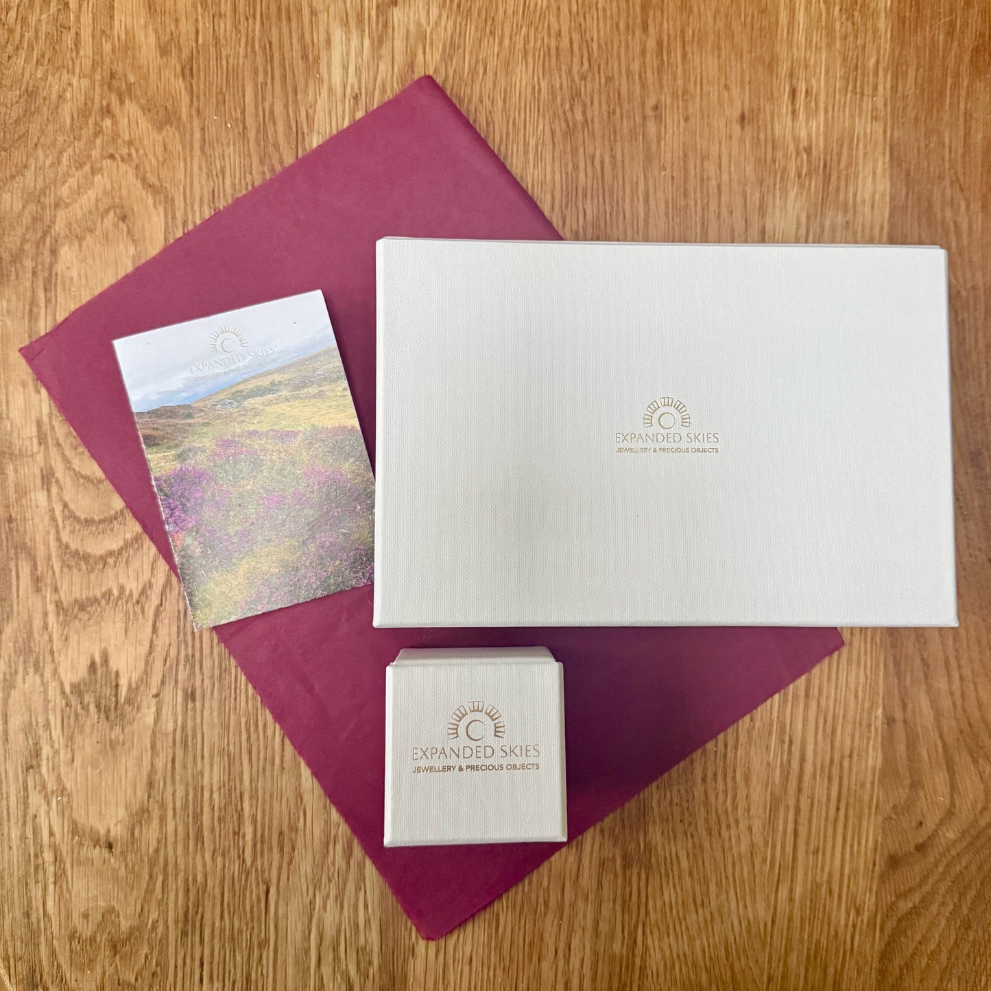 Expanded Skies jewellery comes in a beautiful presentation box, handcrafted in Cornwall made with recycled board and FSC certified textured paper. The boxes are embossed with compostable fine foil. The interior of the box is lined with natural felt made of wool from organically reared sheep by Fern Hill Farm in Somerset. The box has a layer of berry tissue paper made from recycled fibres. The box comes with a card featuring a photograph of Dartmoor printed on FSC certified recycled paper.