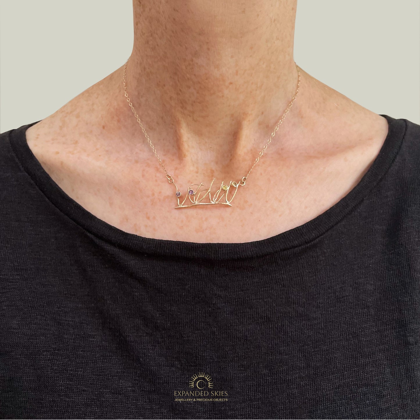 The Expanded Skies Dartmoor Heather and Gorse Necklace evokes the beautiful yellows of the gorse and purples of the heather with two ethically sourced yellow sapphires and two amethysts from Nineteen48 Ltd held in twisting branches of 9ct yellow gold. The chain can be worn at two different lengths, this picture shows shorter length.
This handcrafted unique, one-off, piece makes a wonderful gift, celebrating the evocative and joyful colours of Dartmoor.