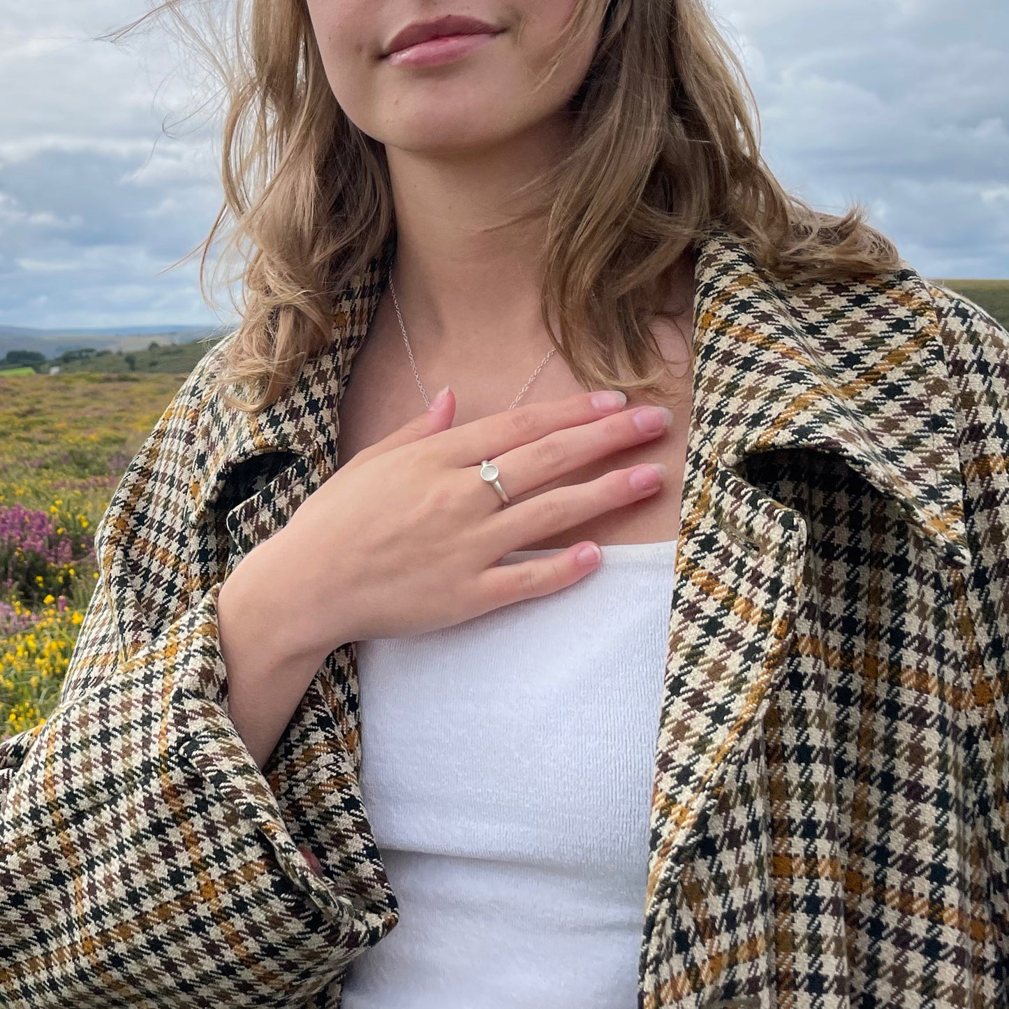 The Full Moon Moonstone Ring has a tranquil beauty of the light of the full moon reflected on a still pool. Totally handcrafted, it features an ethically mined moonstone from Sri Lanka set in quality 100% recycled sterling silver.