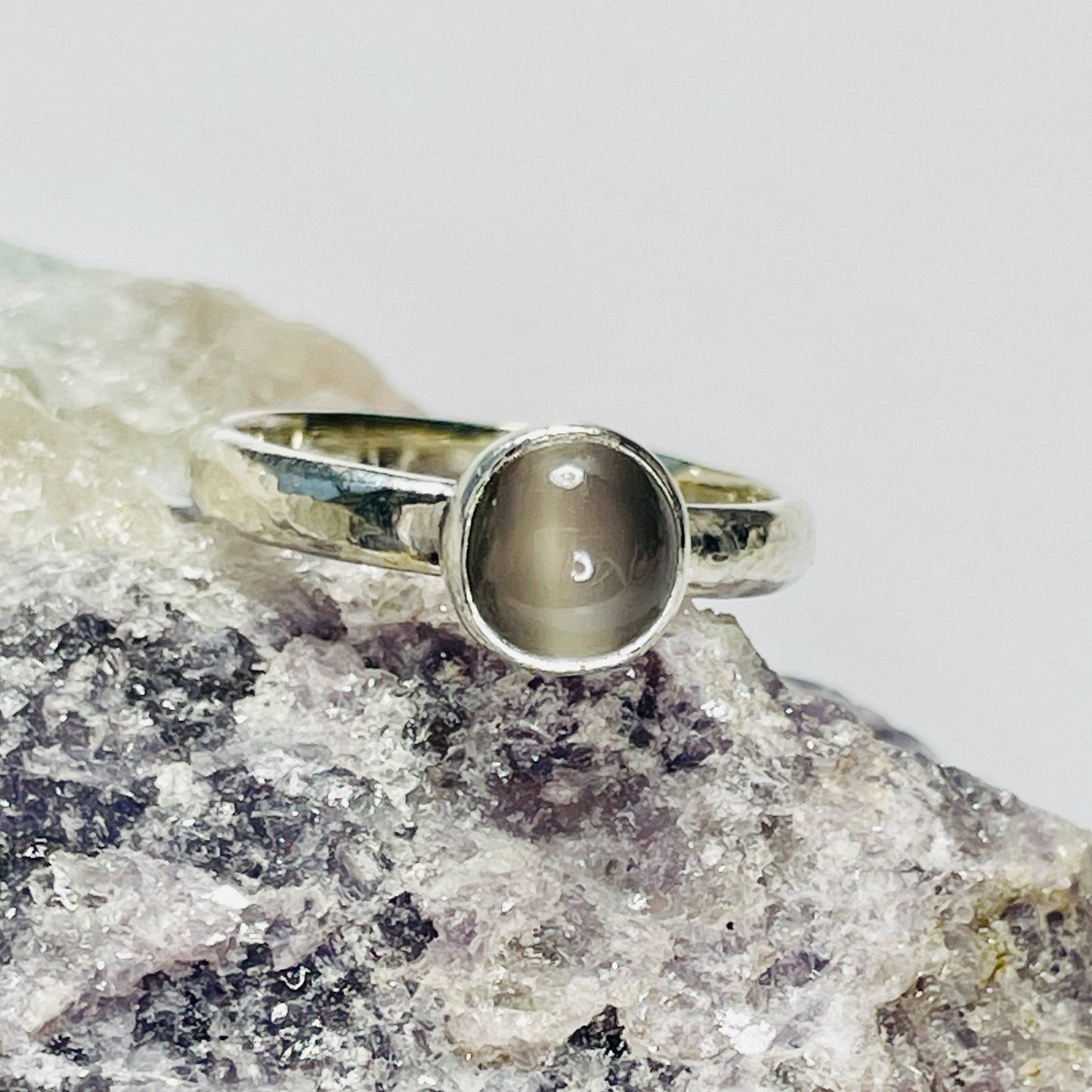 The Expanded Skies Full Moon Moonstone Ring has a tranquil beauty of the light of the full moon reflected on a still pool. Totally handcrafted, it features an ethically mined moonstone from Sri Lanka set in quality 100% recycled sterling silver with a hammered band. 