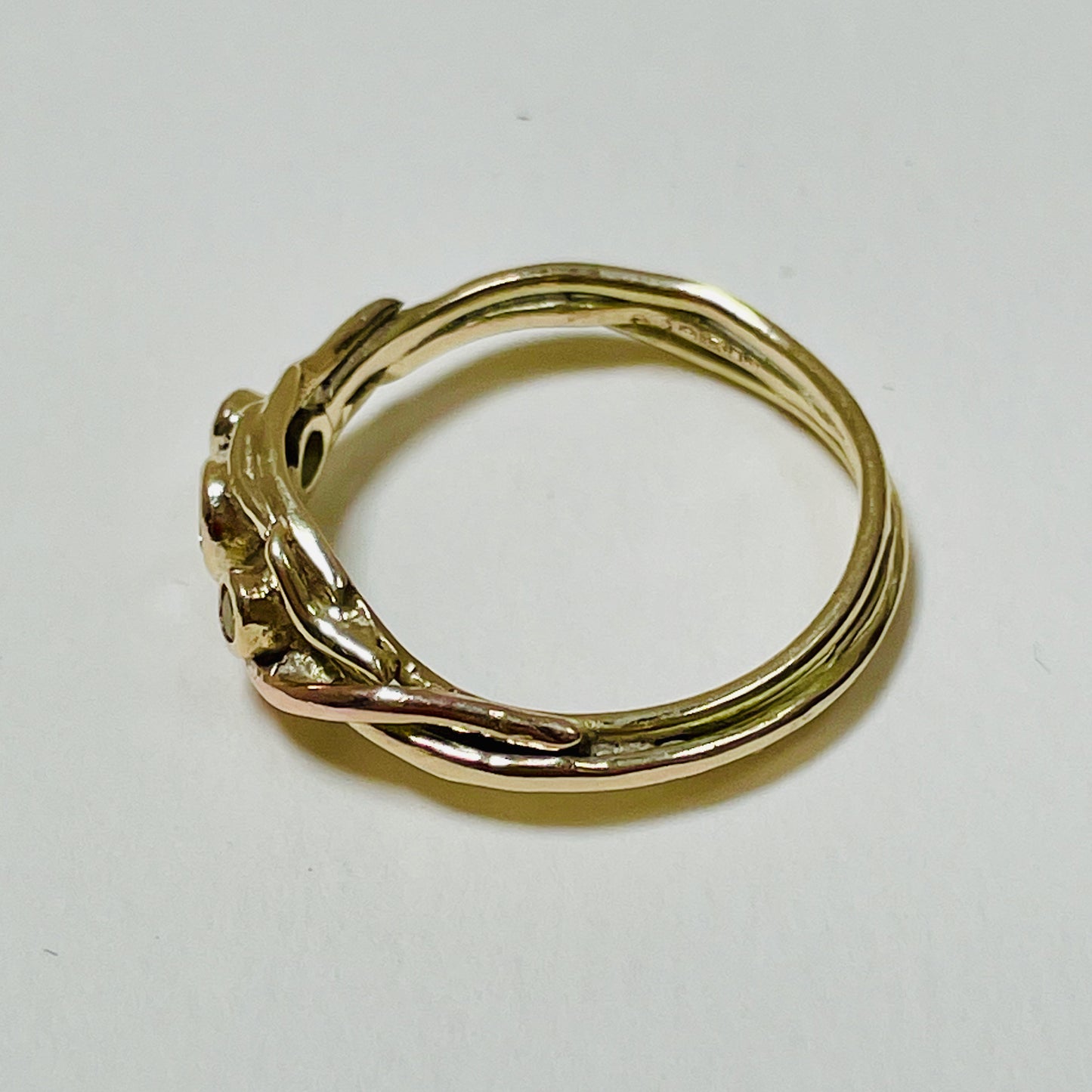 The Haytor Heather and Gorse Ring evokes the beautiful yellows of the gorse and purples of the heather with ethically sourced yellow sapphires and a purple spinel held in three twisting branches of 9ct yellow with accents of 9ct rose gold . This totally handcrafted piece makes a wonderful gift, engagement ring or perfect encapsulation of joy.