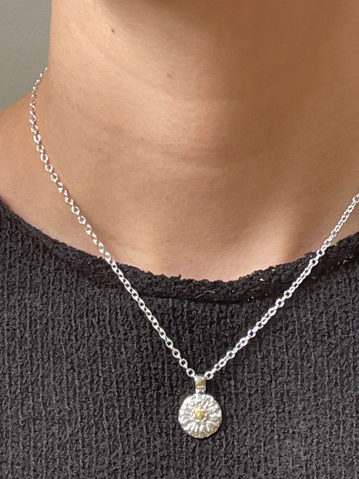 The Expanded Skies Michaelmas Daisy Pendant is totally handcrafted in 100% recycled fine silver (999) with 22ct gold. It has a textured surface that has a twinkly beauty all of its own. 22ct heavy gold foil is applied using keum boo, a traditional Korean gilding technique, that uses heat and pressure, which makes each piece unique. It can be worn every day or for more formal occasions.