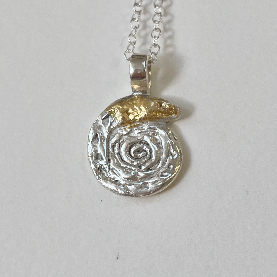 Expanded Skies Spiral Snake Pendant, fine silver with 22ct gold foil accents