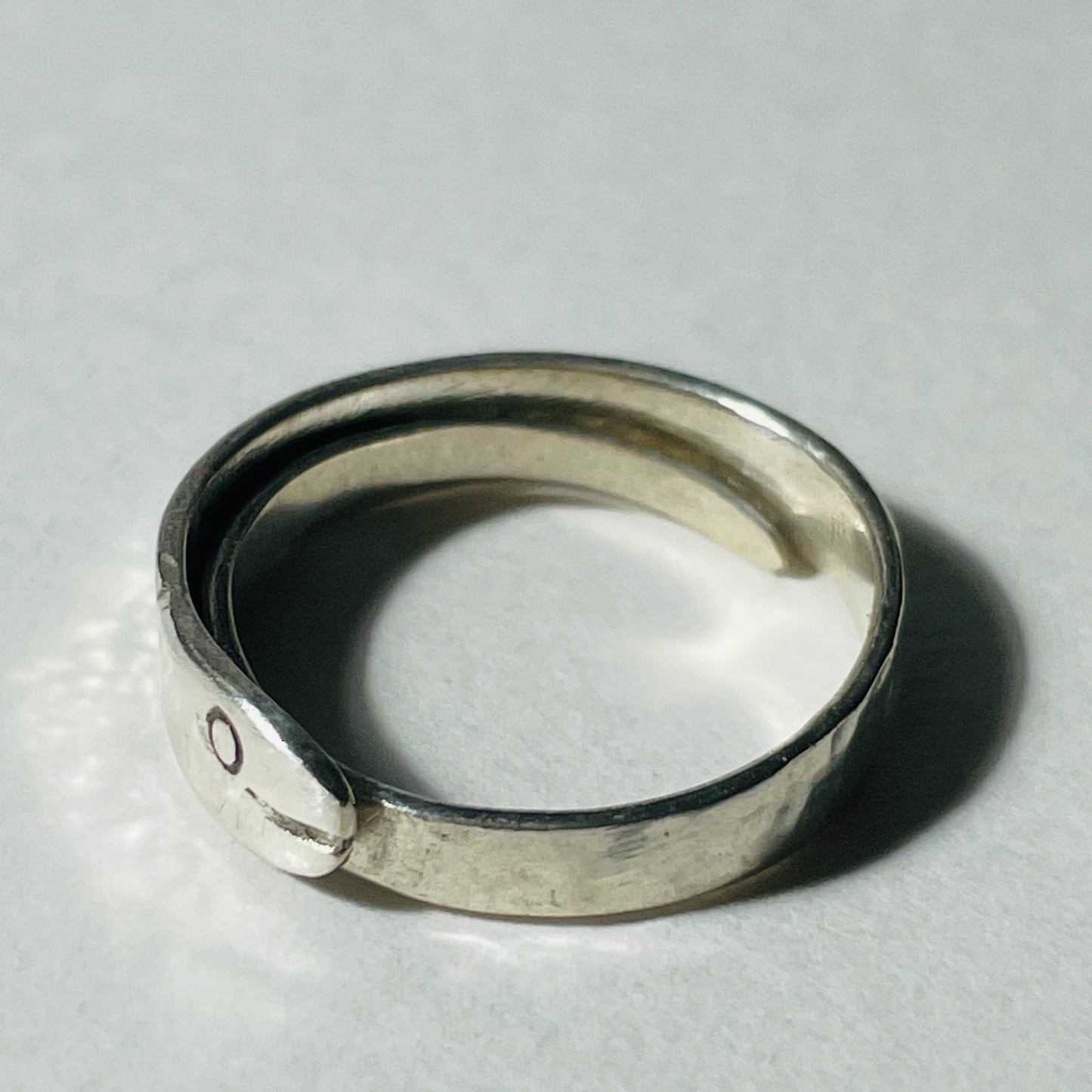 The Expanded Skies Ouroboros Snake ring is totally handcrafted in 100% recycled sterling silver, with etched details. The ouroboros, the snake or dragon eating its tail, is an ancient Egyptian, Greek, Chinese and also a medieval alchemical symbol. The ouroboros represents the cycle of life and eternal renewal. The ouroboros reminds us that all of life is energy and energy doesn't disappear, it transforms.