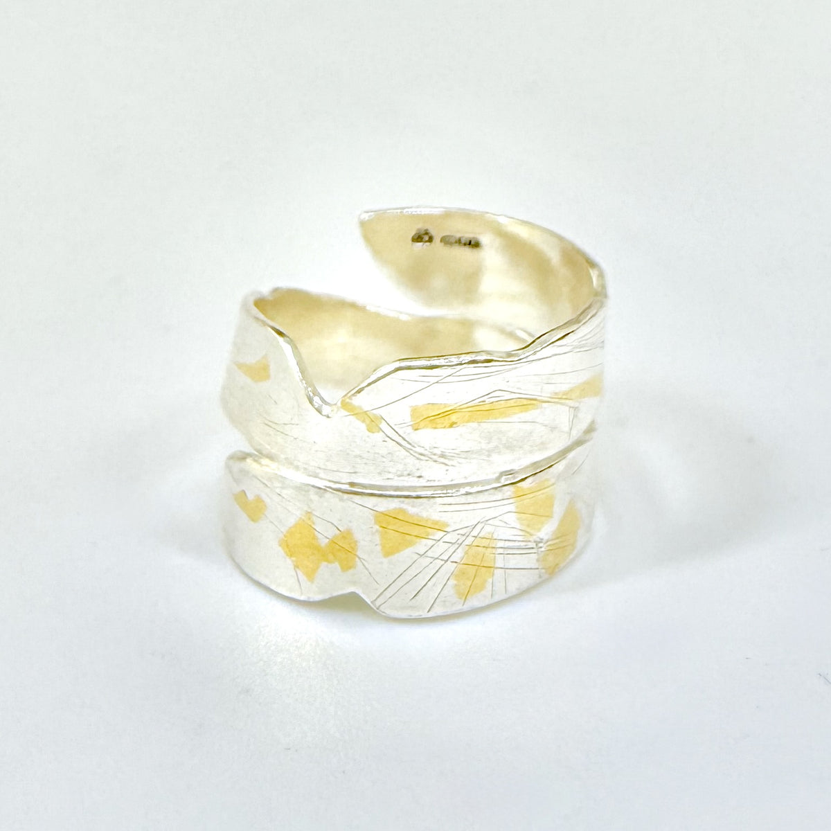 Expanded Skies River Dart Riverbed Ring with 24ct Gold Accents is inspired by the River Dart drawn with hand engraving and gold accents.