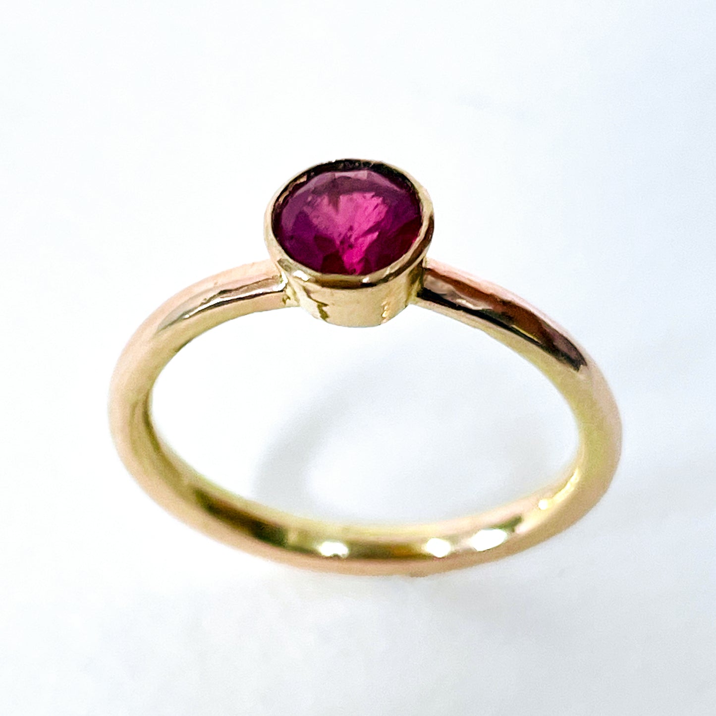 The Expanded Skies Ruby Chalice Ring has a stunningly beautiful ethically sourced Tanzanian deep pink-red ruby, encircled with 18ct rose gold tapered chalice on a 9ct rose gold band. This totally handcrafted piece makes a wonderful gift, engagement ring or perfect encapsulation of love and joy.
