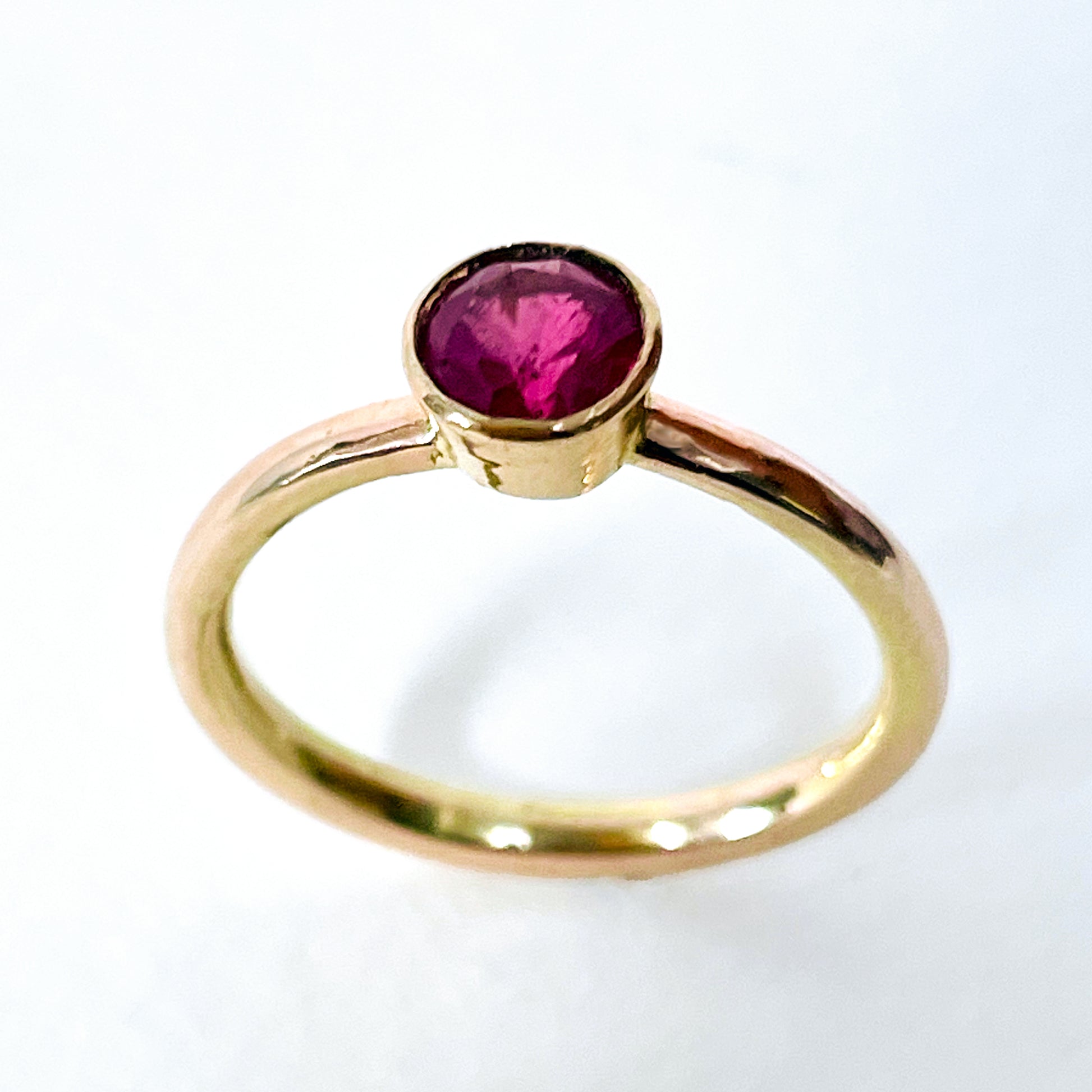The Expanded Skies Ruby Chalice Ring has a stunningly beautiful ethically sourced Tanzanian deep pink-red ruby, encircled with 18ct rose gold tapered chalice on a 9ct rose gold band. This totally handcrafted piece makes a wonderful gift, engagement ring or perfect encapsulation of love and joy.