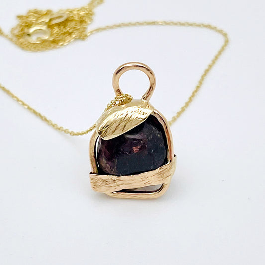 The Expanded Skies Raw Garnet Engraved Pendant has a beautiful raw Norwegian garnet set in 9ct gold. Handcrafted on the edge of Dartmoor and made from high quality recycled gold, Hallmarked by the London Assay Office. The garnet is housed in gold gateway, understated and beautiful, it can be worn every day or for special occasions. This is a unique piece, one-of-a-kind.