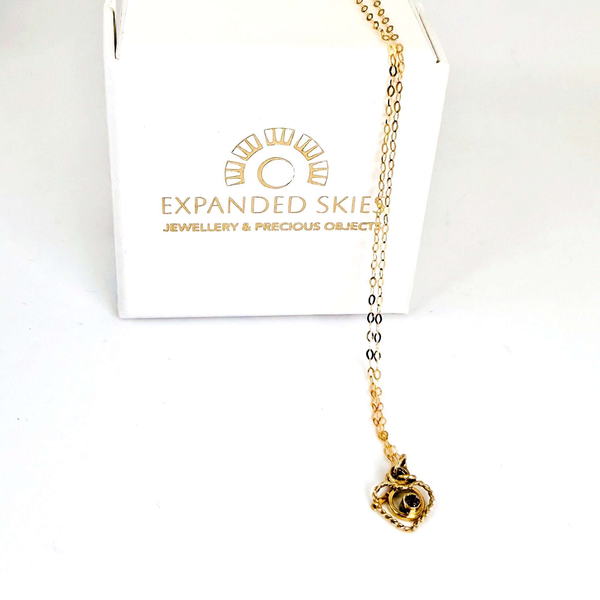 The Expanded Skies Joyful Heart Amethyst Filigree Necklace Pendant has a beautiful ethically sourced faceted amethyst set in 9ct gold bezel on a 9ct filigree gold heart. Totally handcrafted on the edge of Dartmoor and made from high quality recycled gold. Understated and beautiful, it can be worn every day or for special occasions. With Expanded Skies box handcrafted in Cornwall.