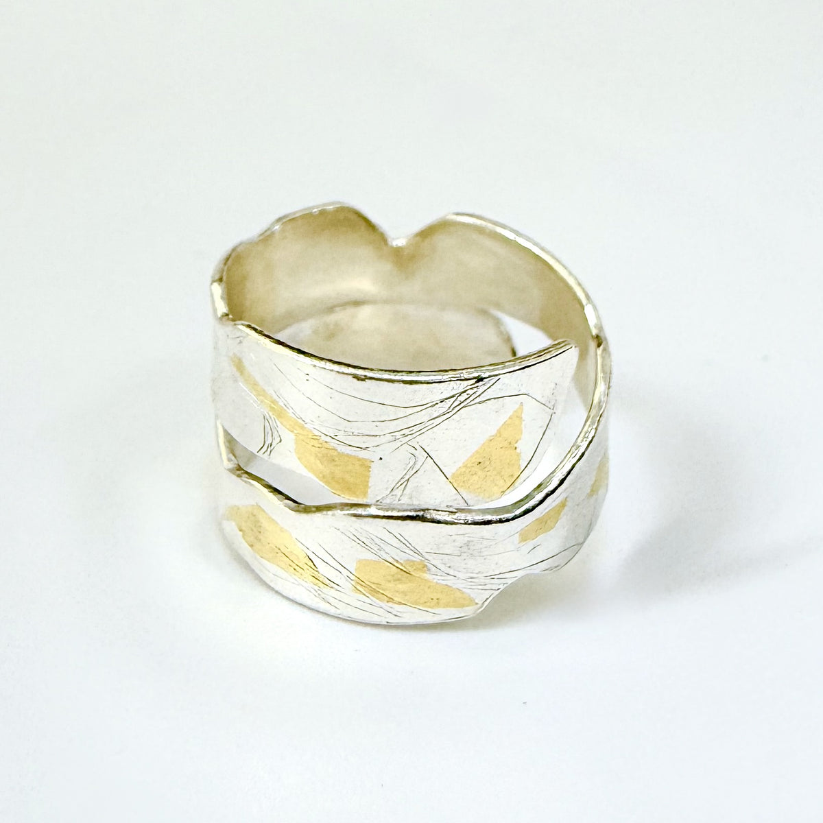 Expanded Skies River Dart Riverbed Ring with 24ct Gold Accents is inspired by the River Dart drawn with hand engraving and gold accents.