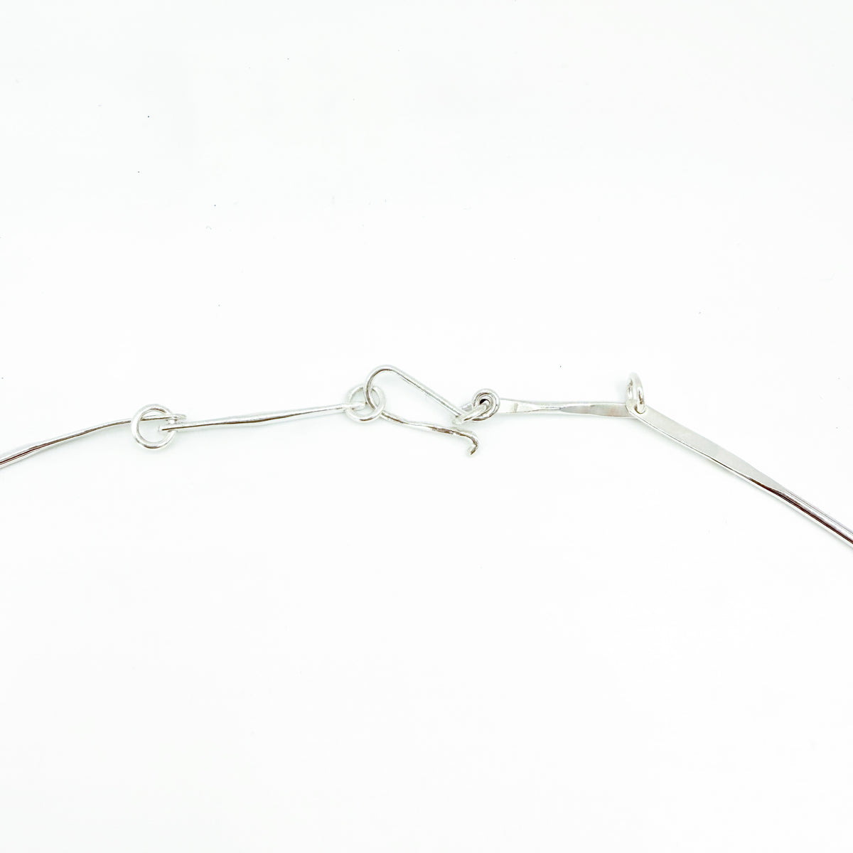 The Expanded Skies Dartmoor Wild Honeysuckle Leaves Necklace is a hand engraved of the graceful honeysuckle (Lonicera periclymenum) as it winds through the trees and brambles in Ausewell Woods. Handcrafted in fine silver with 24ct gold accents, with a completely handcrafted stem and tendril chain in sterling silver. Simple and elegant with a polished finish, it can be worn everyday for any occasion.