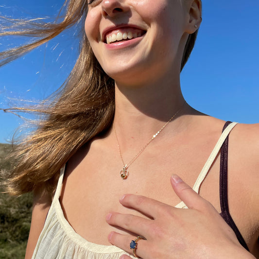 On Dartmoor the Dartmoor Sun and Skies Sapphire Ring reflects the big Dartmoor skies, the contrasting colours and textures of the moving light over the landscape, created with ethically sourced raw and facetted sapphires and different shades of gold.