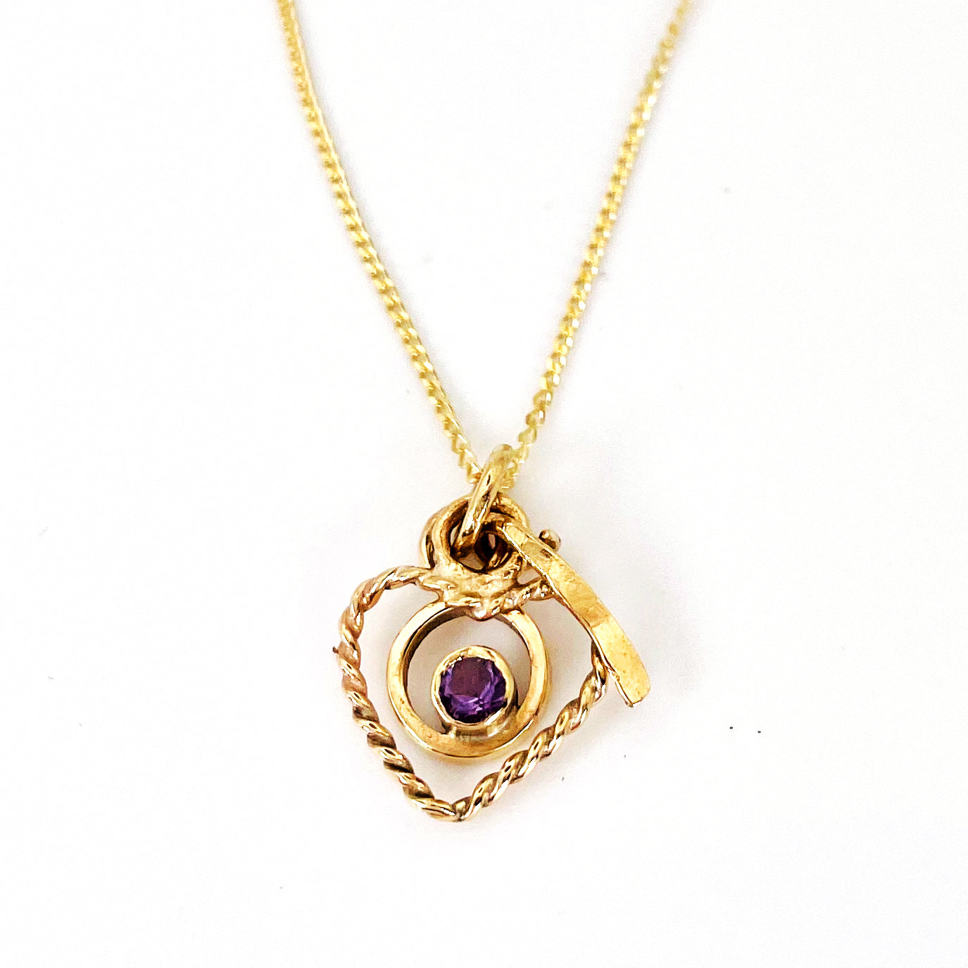 The Expanded Skies Joyful Heart Amethyst Filigree Necklace Pendant has a beautiful ethically sourced faceted amethyst set in 9ct gold bezel on a 9ct filigree gold heart. Totally handcrafted on the edge of Dartmoor and made from high quality recycled gold. Understated and beautiful, it can be worn every day or for special occasions.