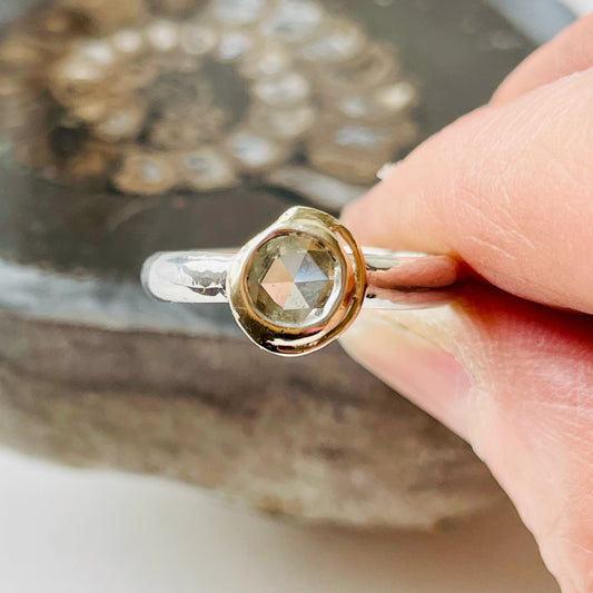 Haytor Quarry Pool White Sapphire Ring has a beautiful ethically sourced Sri Lankan faceted white 5mm sapphire, set in 9ct gold, on sterling silver band. Completely handcrafted from high quality recycled sterling silver and recycled gold. Understated and beautiful, it can be worn every day and for special occasions.
