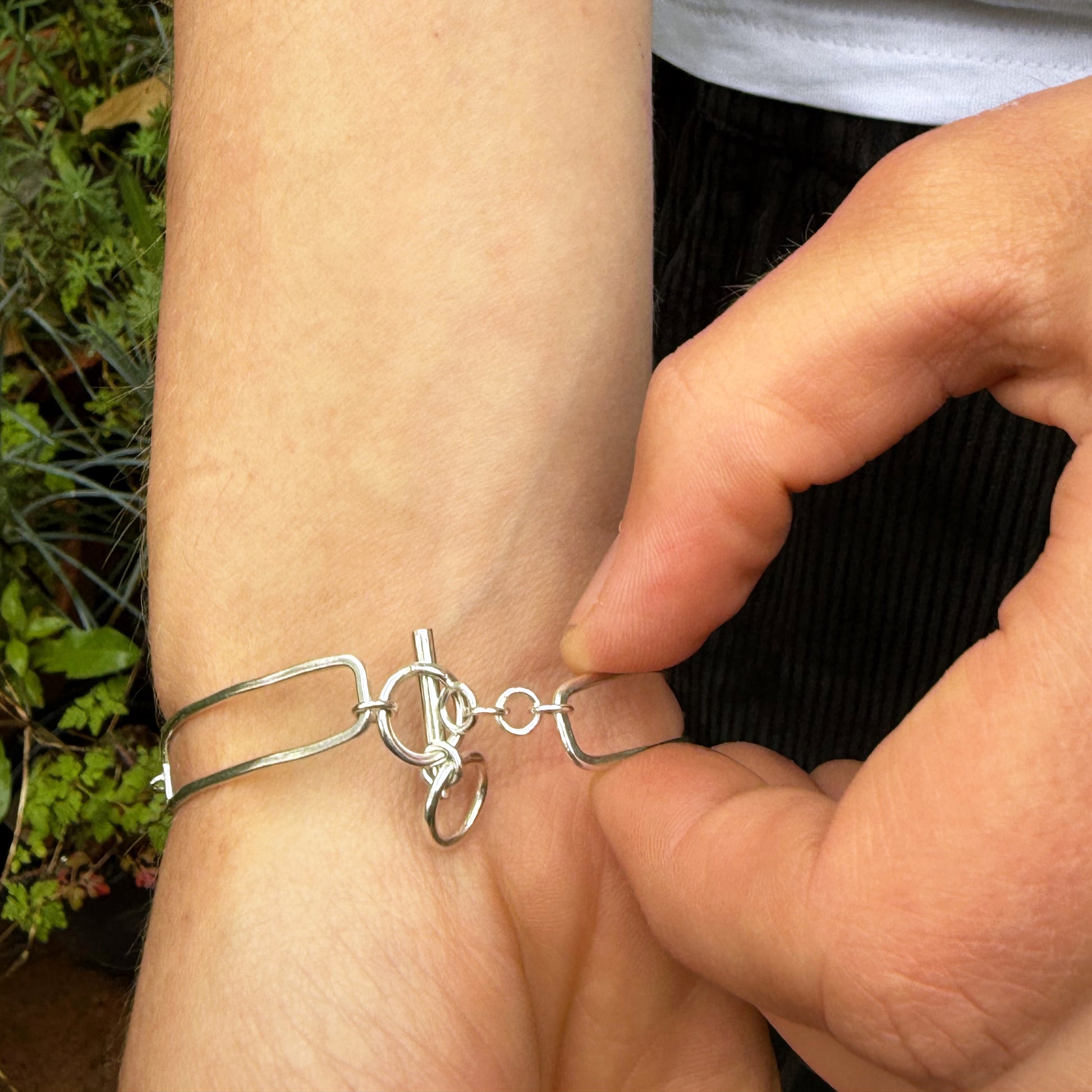 The Expanded Skies Dartmoor Purslane, Hand Engraved Bracelet, celebrates the beauty of the edible Dartmoor flower the Pink Purslane (Claytonia sibirica), created in fine and sterling silver with 24ct gold accents.