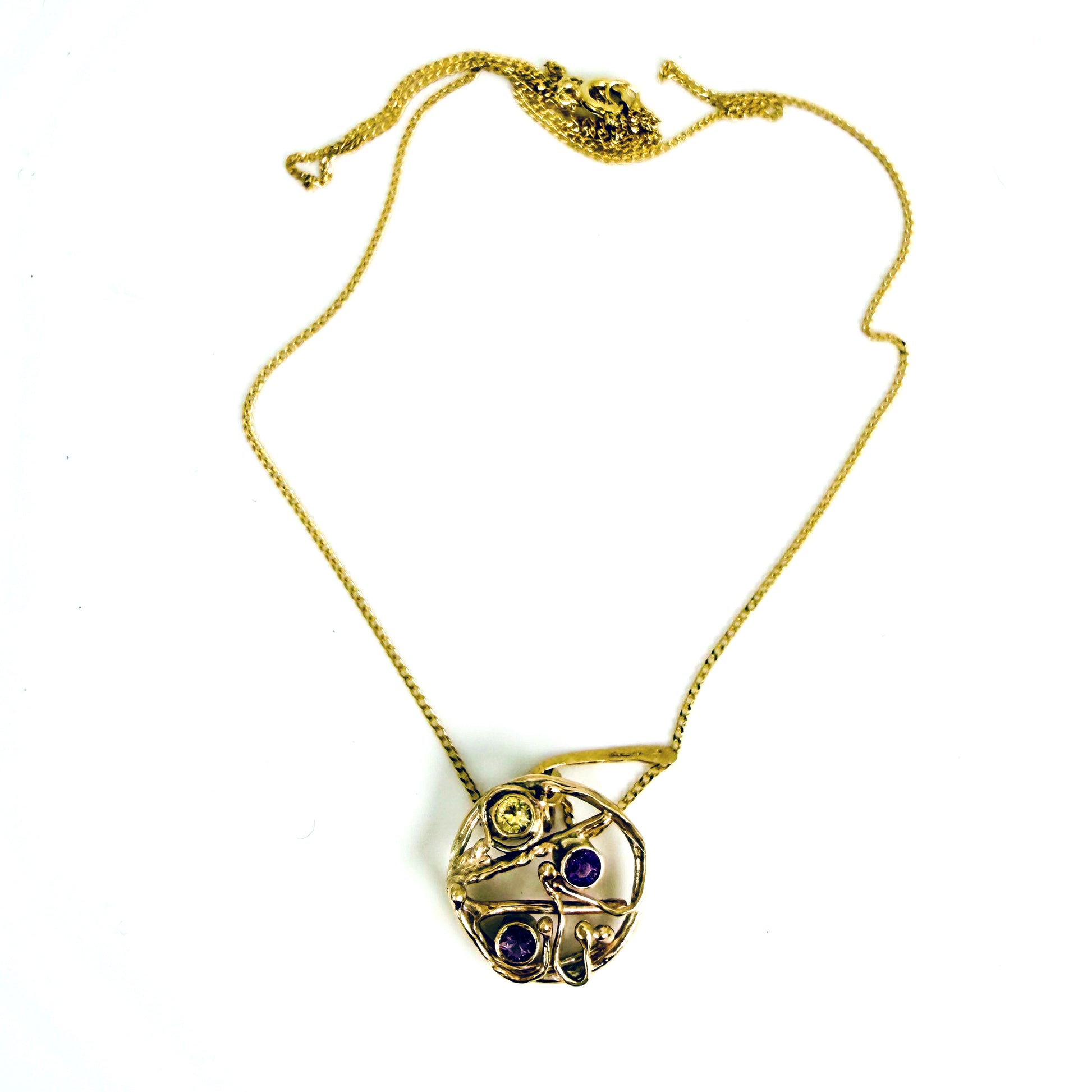 The Expanded Skies High Moor Heather and Gorse Amethyst and Sapphire Pendant evokes the beautiful yellows of the gorse and purples of the heather with an ethically sourced yellow sapphire and two amethysts held in twisting branches of 9ct yellow gold. The pendant comes with a 9ct gold chain, a choice of lengths are available.