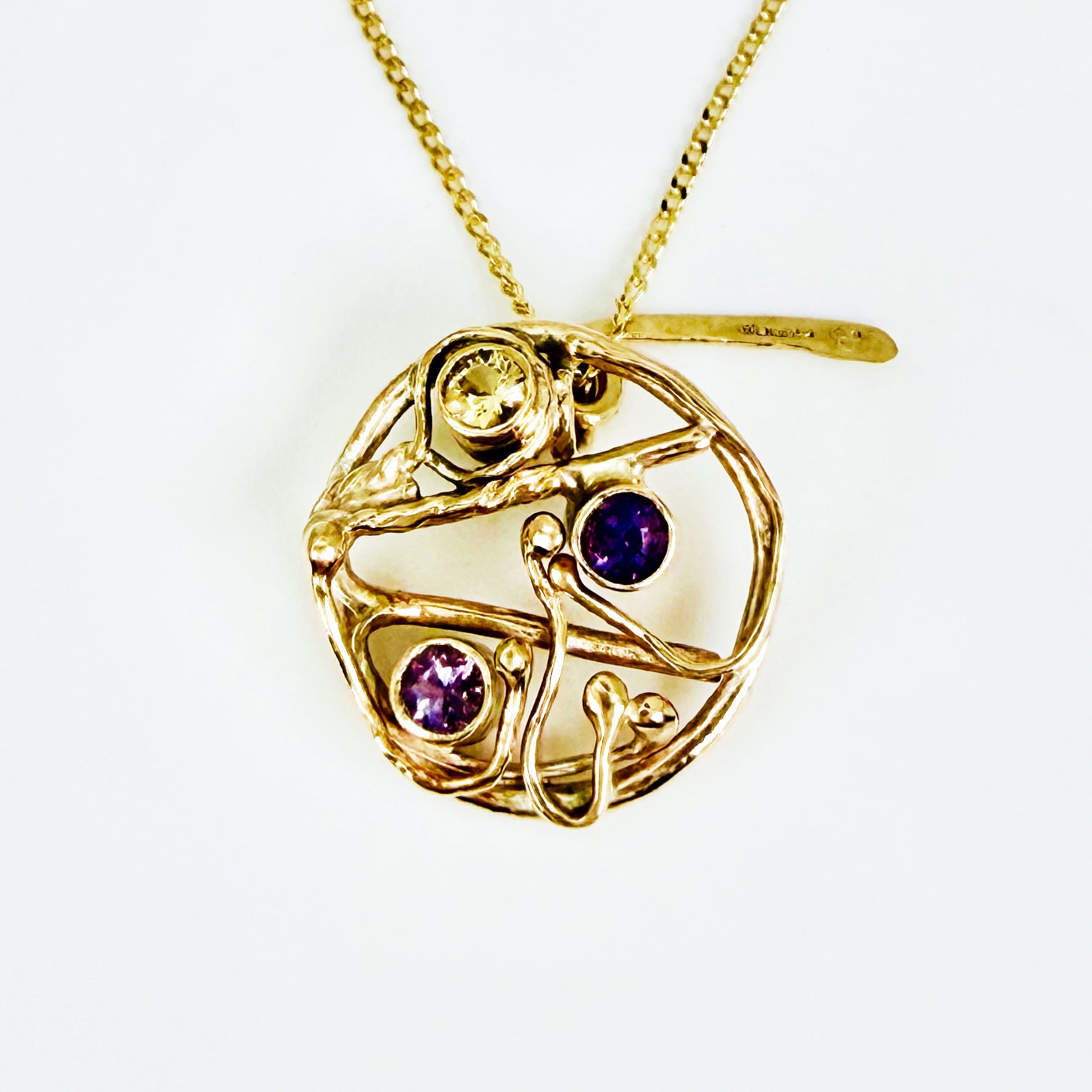 The Expanded Skies High Moor Heather and Gorse Amethyst and Sapphire Pendant evokes the beautiful yellows of the gorse and purples of the heather with an ethically sourced yellow sapphire and two amethysts held in twisting branches of 9ct yellow gold. The pendant comes with a 9ct gold chain, a choice of lengths are available.