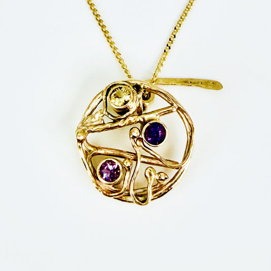 The Expanded Skies High Moor Heather and Gorse Amethyst and Sapphire Pendant evokes the beautiful yellows of the gorse and purples of the heather with an ethically sourced yellow sapphire and two amethysts held in twisting branches of 9ct yellow gold. The pendant comes with a 9ct gold chain, a choice of lengths are available.
