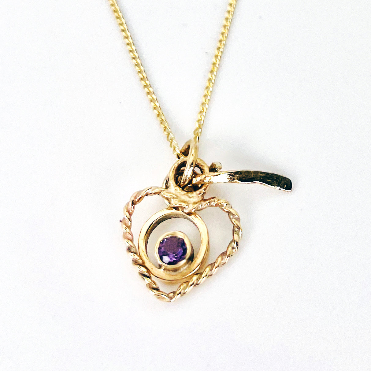 The Expanded Skies Joyful Heart Amethyst Filigree Necklace Pendant has a beautiful ethically sourced faceted amethyst set in 9ct gold bezel on a 9ct filigree gold heart. Totally handcrafted on the edge of Dartmoor and made from high quality recycled gold. Understated and beautiful, it can be worn every day or for special occasions.