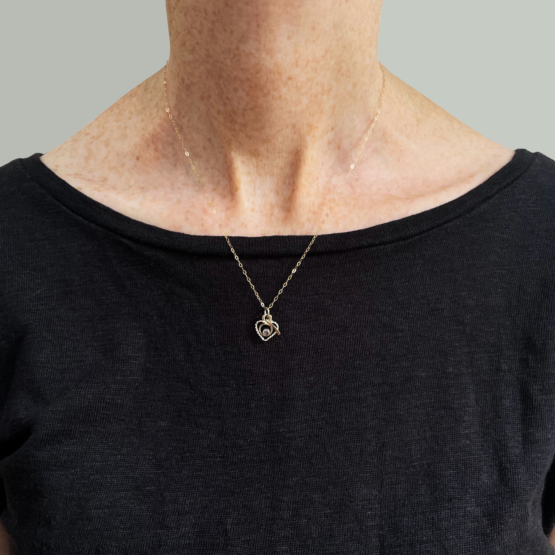 The Expanded Skies Joyful Heart Amethyst Filigree Necklace Pendant has a beautiful ethically sourced faceted amethyst set in 9ct gold bezel on a 9ct filigree gold heart. Totally handcrafted on the edge of Dartmoor and made from high quality recycled gold. Understated and beautiful, it can be worn every day or for special occasions.