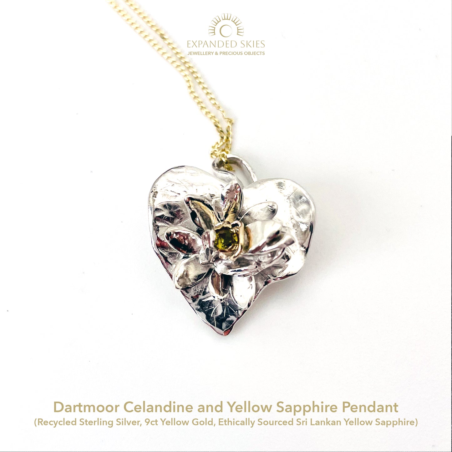Expanded Skies Celandine Sapphire Pendant, inspired by the profusion of celandine petals found in the meadow near Cuddyford and all along the Dartmoor byways, pure joy! With a 9ct gold or sterling silver chain.