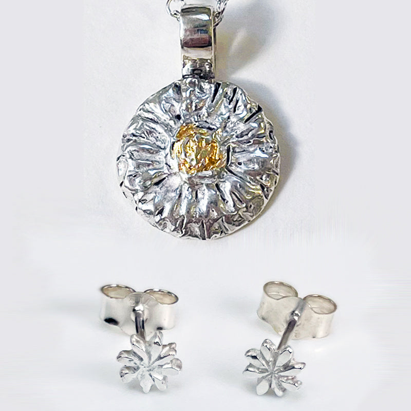 The Expanded Skies Michaelmas Daisy Pendant is totally handcrafted in 100% recycled fine silver (999) with 24ct gold.  It has a textured surface that has a twinkly beauty all of its own. 24ct heavy gold foil is applied using keum boo, a traditional Korean gilding technique, that uses heat and pressure, which makes each piece unique. It can be worn every day or for more formal occasions. Worn together with Dartmoor Daisy Fine Silver studs