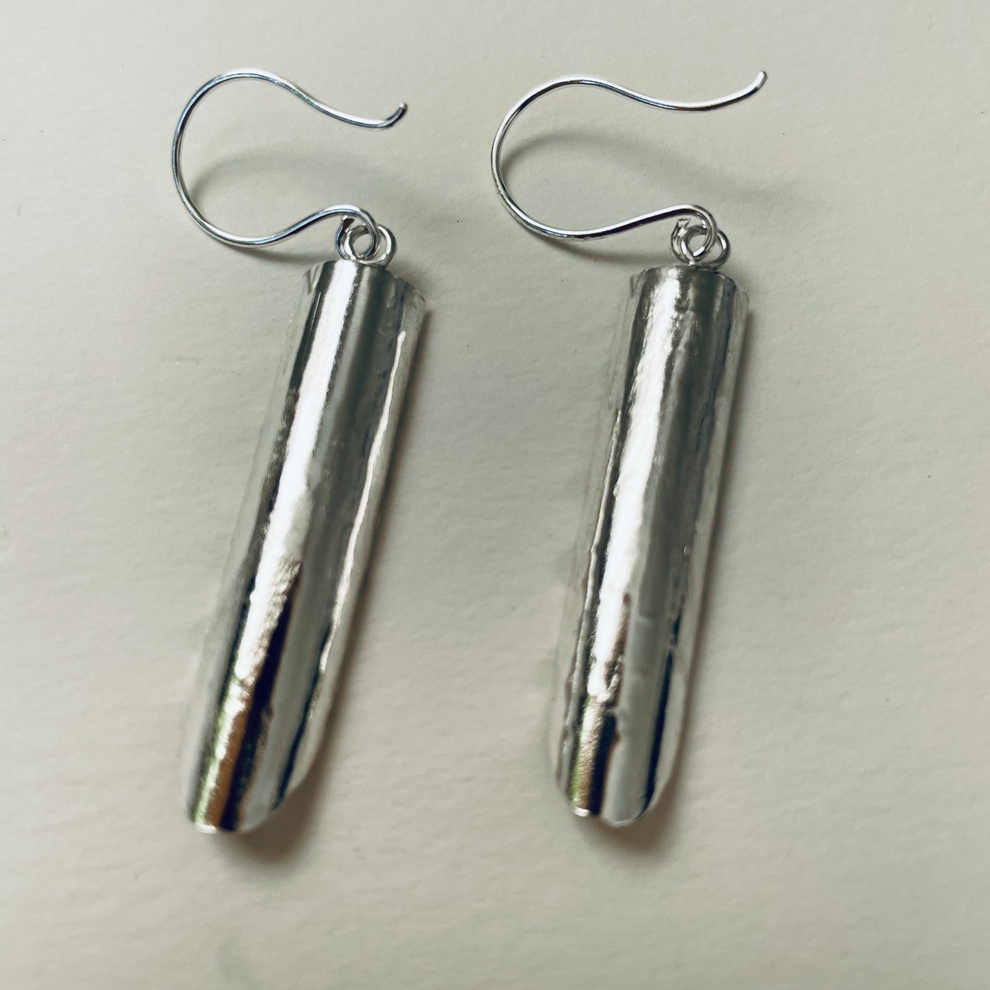 Inspired by the enchanting Holne woods waterfall, the Expanded Skies, Dartmoor Waterfall Earrings are handcrafted from solid recycled sterling silver with recycled sterling silver handcrafted ear wires. Simple and elegant, with an engraved texture on all sides. They can be worn everyday.