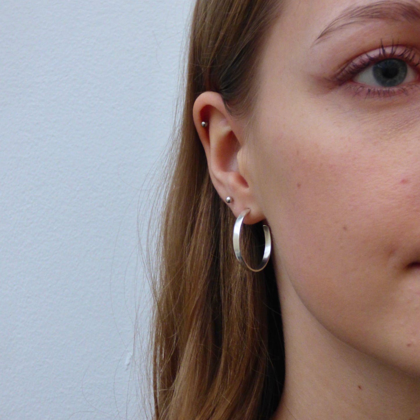  The Expanded Skies, Dartmoor Hoop Earrings are handcrafted from solid recycled sterling silver with a recycled sterling silver pin and scroll back. Simple and elegant, they can be worn everyday to accompany any occasion.