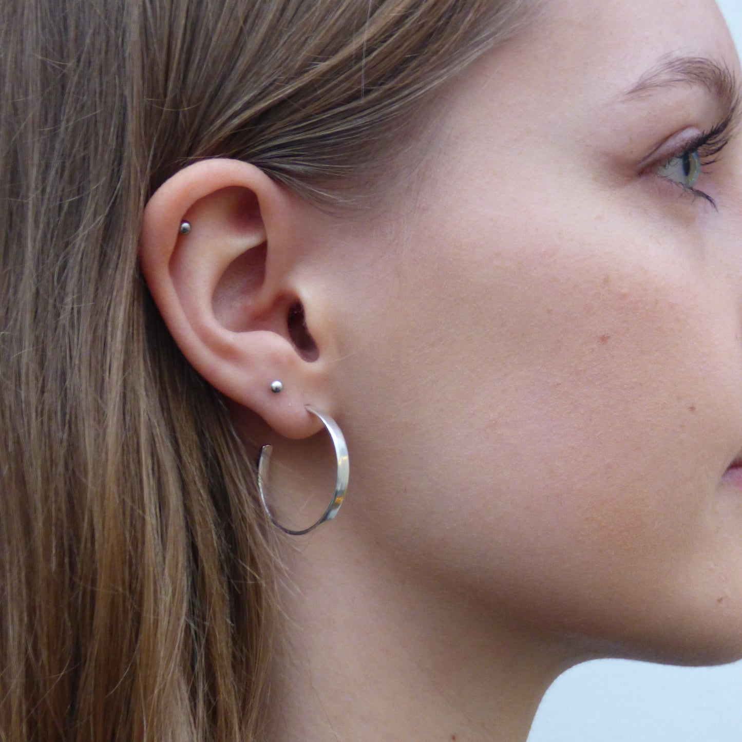  The Expanded Skies, Dartmoor Hoop Earrings are handcrafted from solid recycled sterling silver with a recycled sterling silver pin and scroll back. Simple and elegant, they can be worn everyday to accompany any occasion.