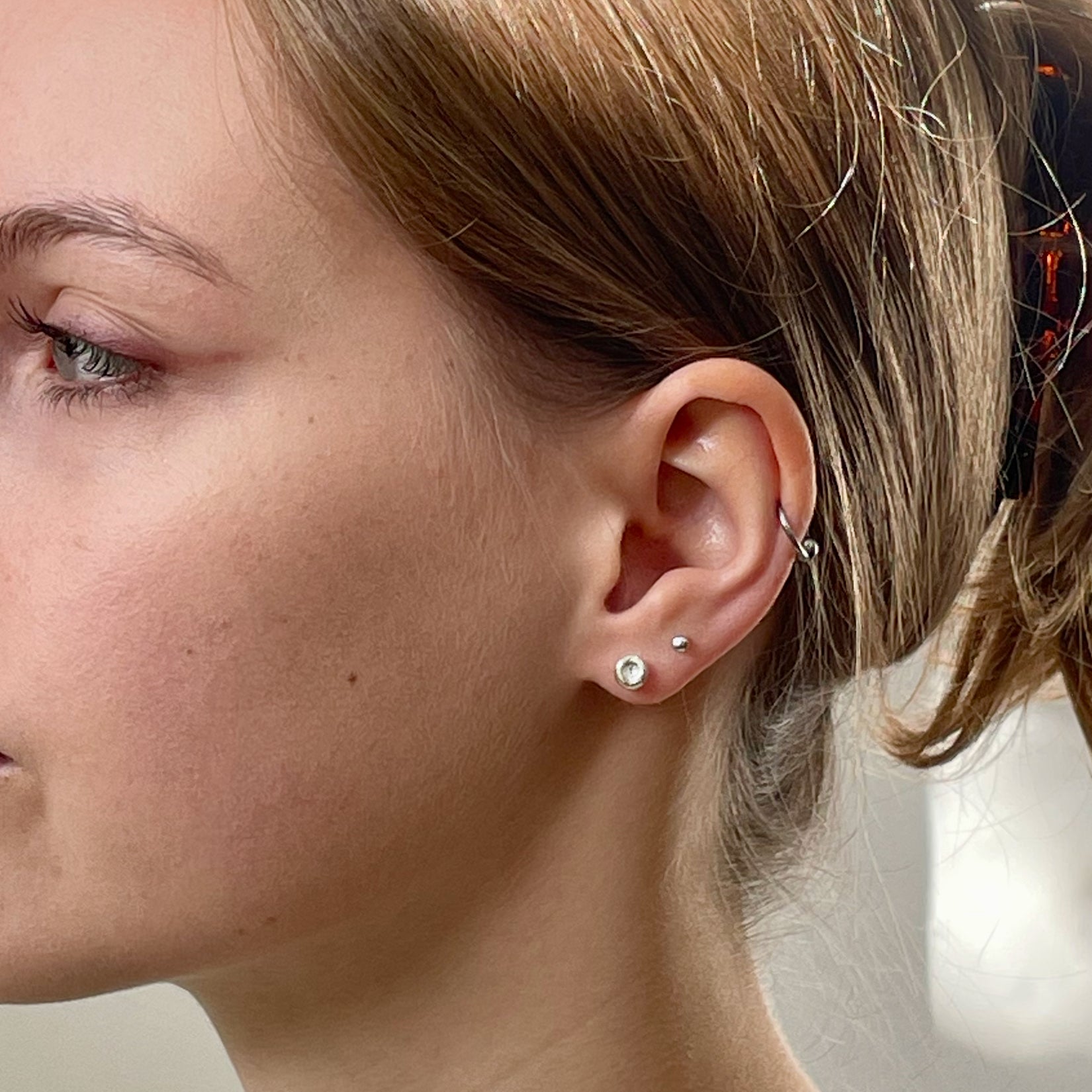 Inspired by the sculptural beauty of the Dartmoor granite rocks.   The Dartmoor Rocks Studs are handcrafted in recycled fine silver with recycled sterling silver ear pins and scrolls, each stud is unique. Simple and elegant with a textured finish, and a polished finish they can be worn everyday for any occasion.