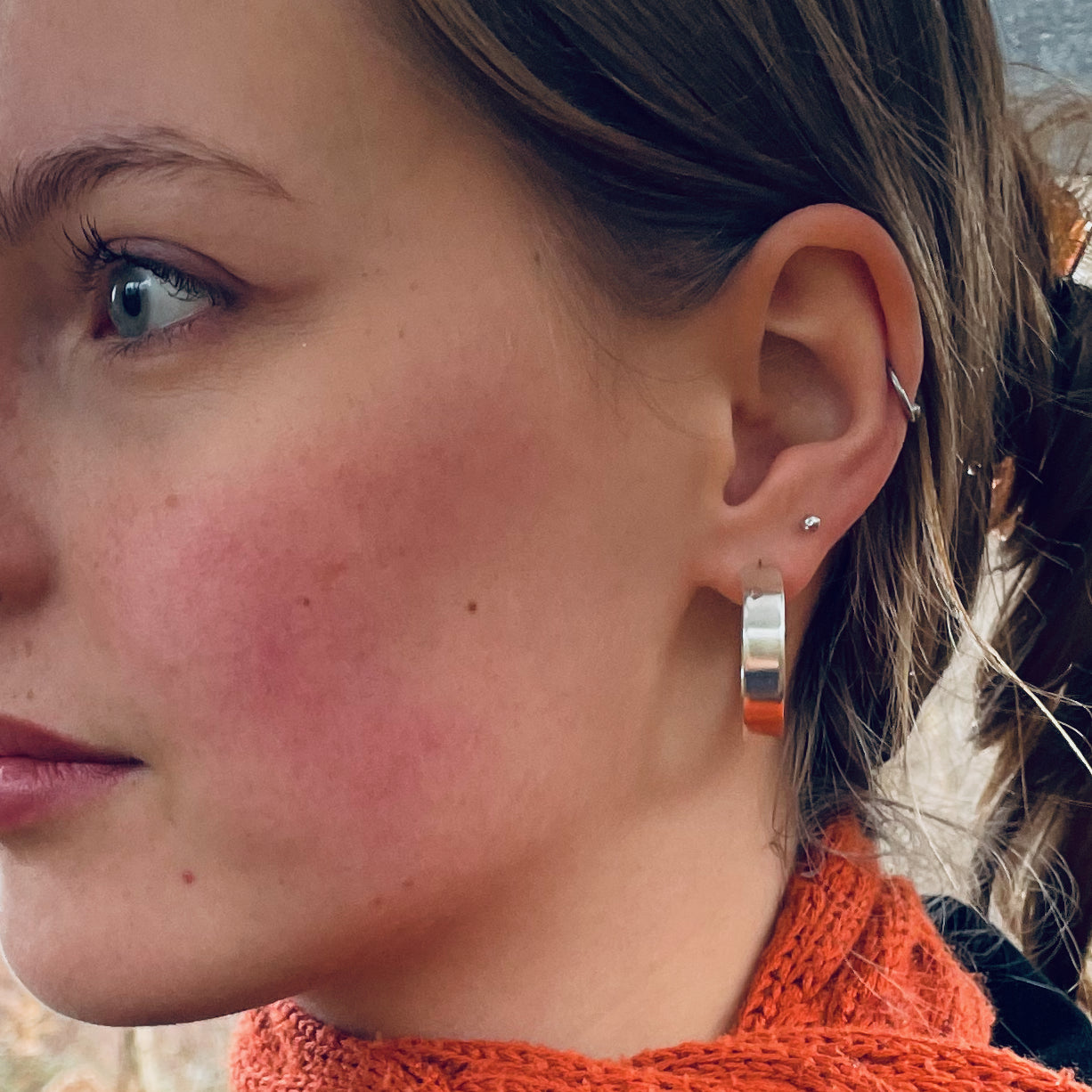 The Expanded Skies, Dartmoor Wide Hoop Earrings are handcrafted from solid recycled sterling silver with a recycled sterling silver pin and scroll back. Simple and elegant, they can be worn everyday to accompany any occasion.