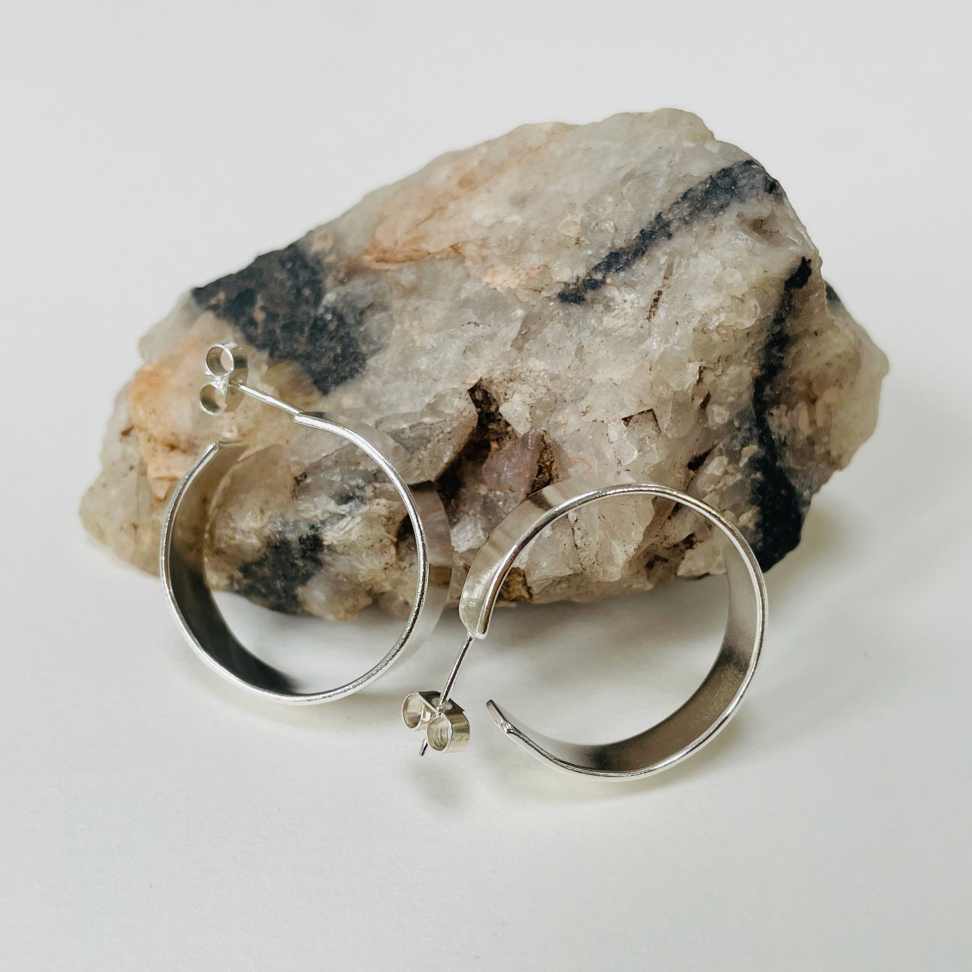 The Expanded Skies, Dartmoor Wide Hoop Earrings are handcrafted from solid recycled sterling silver with a recycled sterling silver pin and scroll back. Simple and elegant, they can be worn everyday to accompany any occasion.