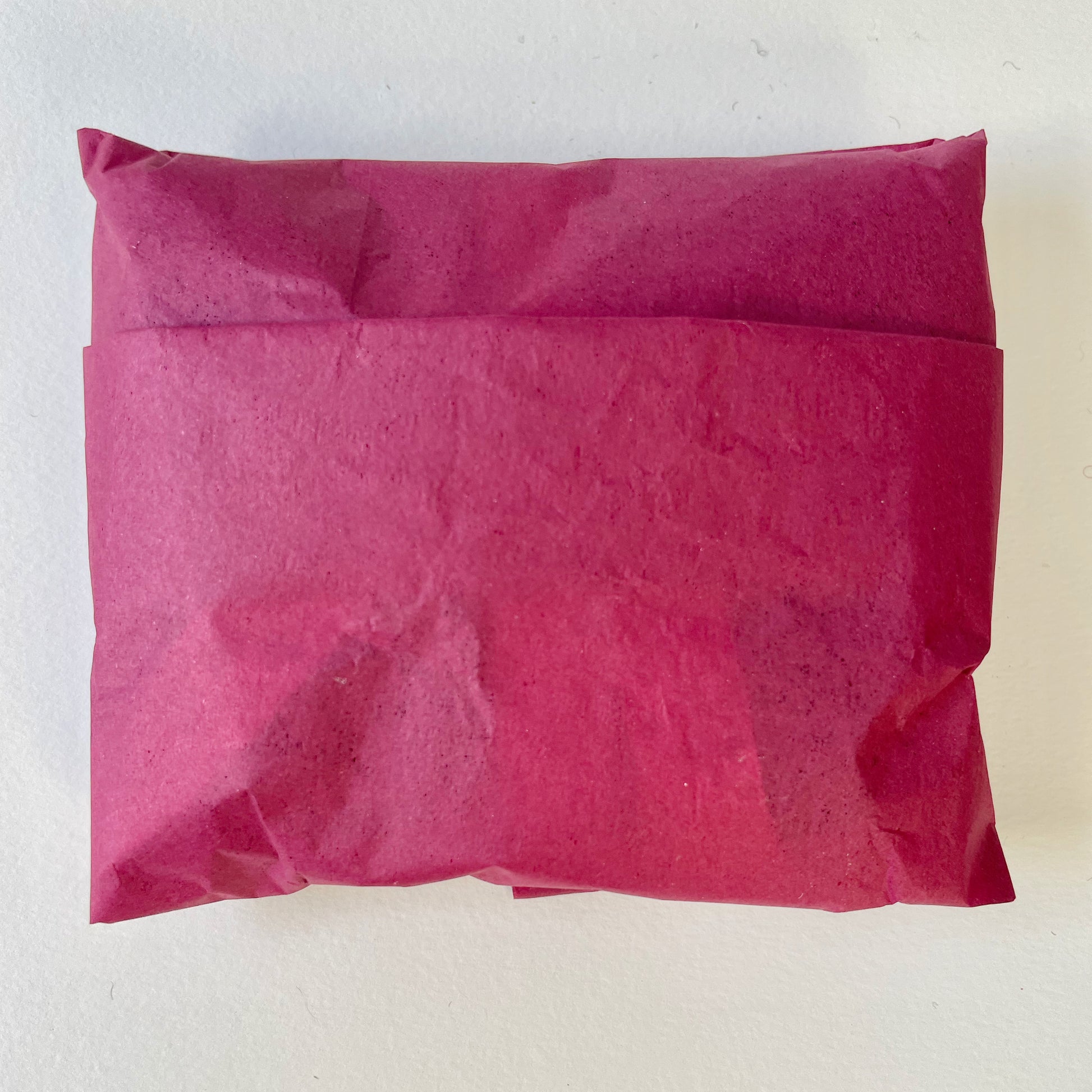 Expanded Skies sustainable packaging, felt from organically reared sheep from Fernhill Farm Somerset and cotton and linen ribbon, berry coloured, recycled paper tissue 