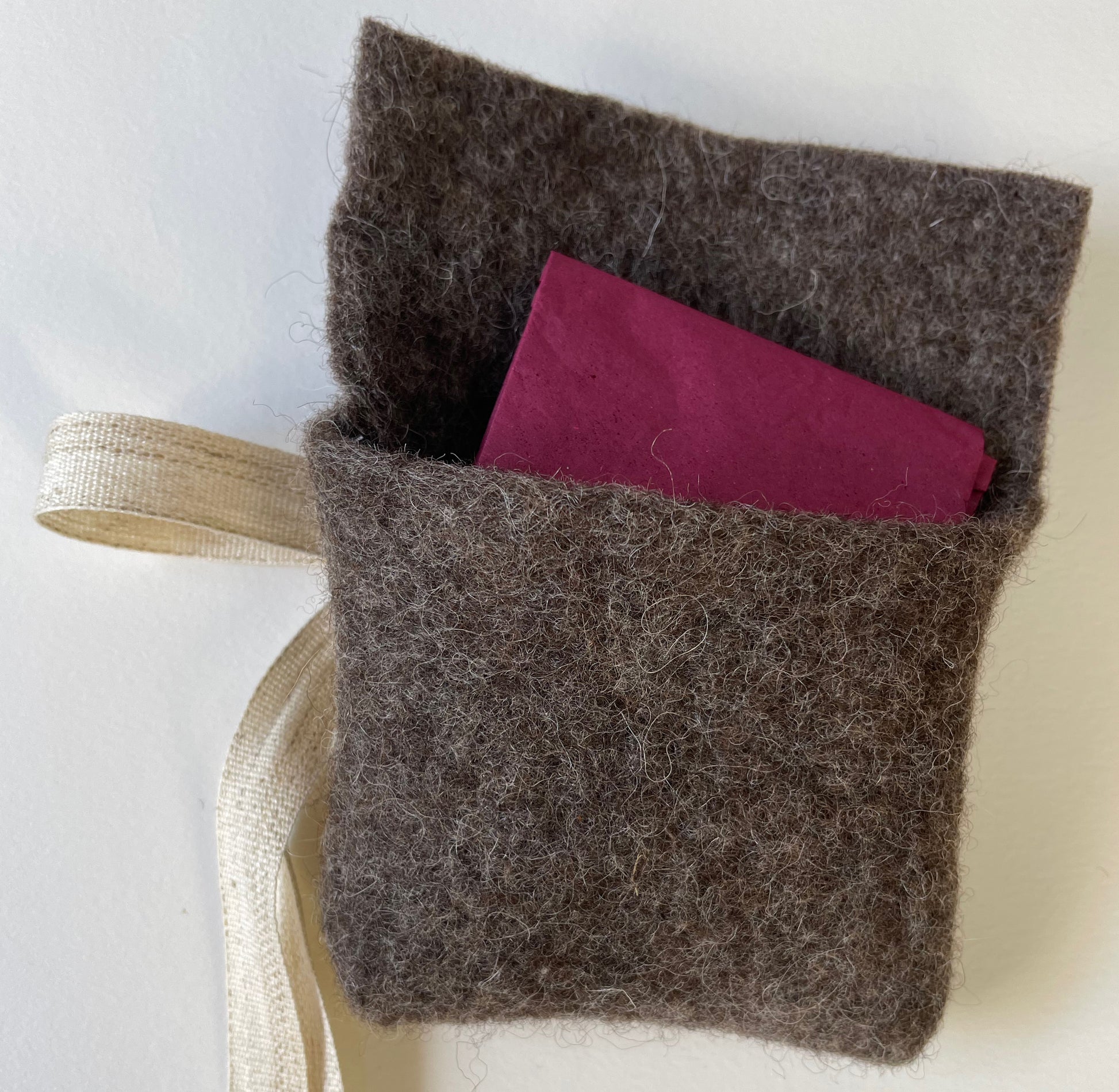 Expanded Skies sustainable packaging, felt from organically reared sheep from Fernhill Farm Somerset and cotton and linen ribbon, berry coloured, recycled paper tissue 