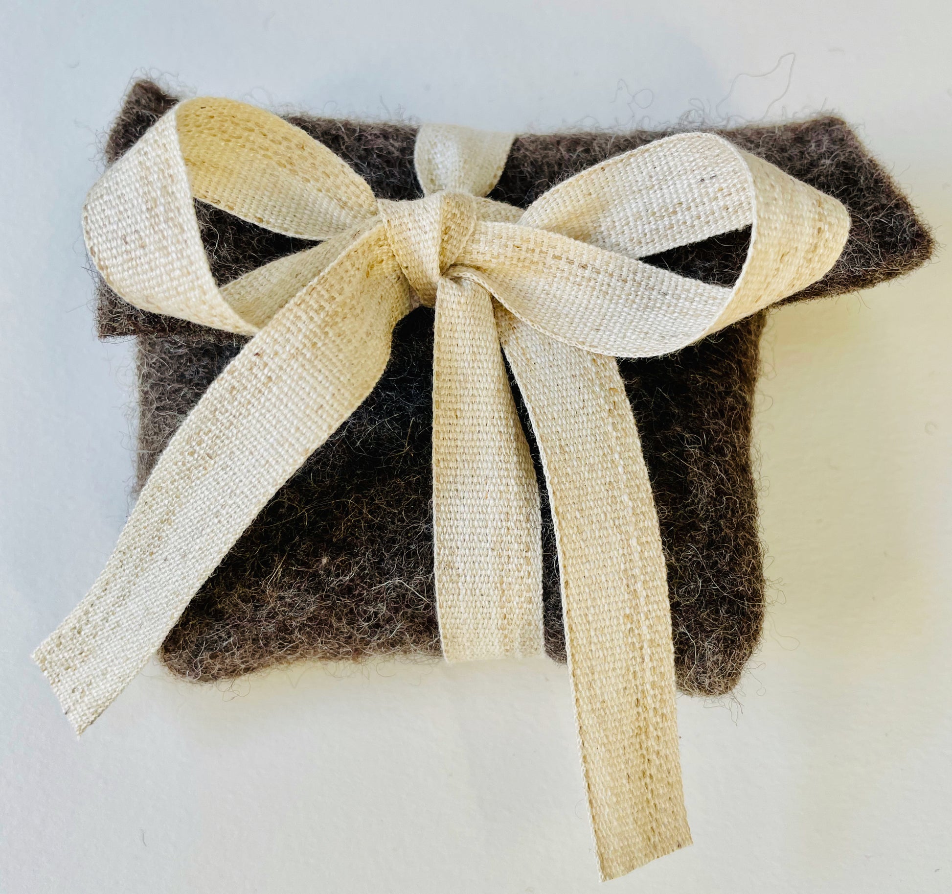 Expanded Skies sustainable packaging, felt from organically reared sheep from Fernhill Farm Somerset and cotton and linen ribbon, berry coloured, recycled paper tissue 