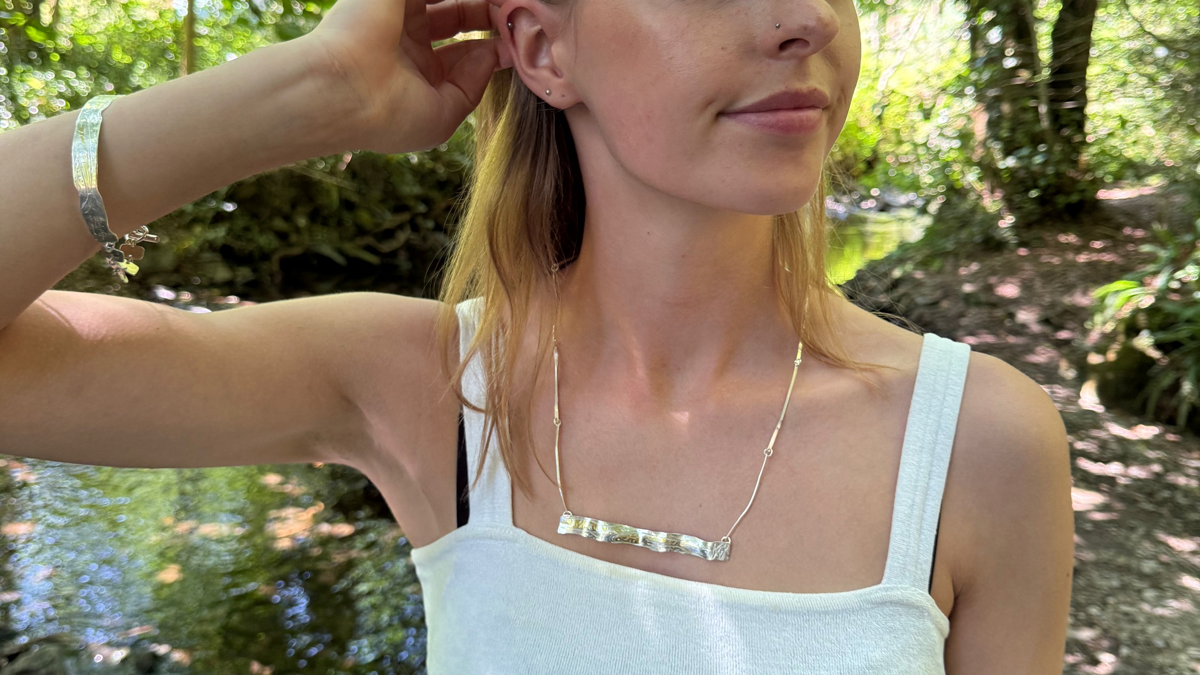 
The Expanded Skies Dartmoor minnows bracelet and necklace capturesthe graceful beauty of the minnows as they somersault through the glistening River Dart at Hembury Woods, created in fine and sterling silver with 24ct gold accents.
