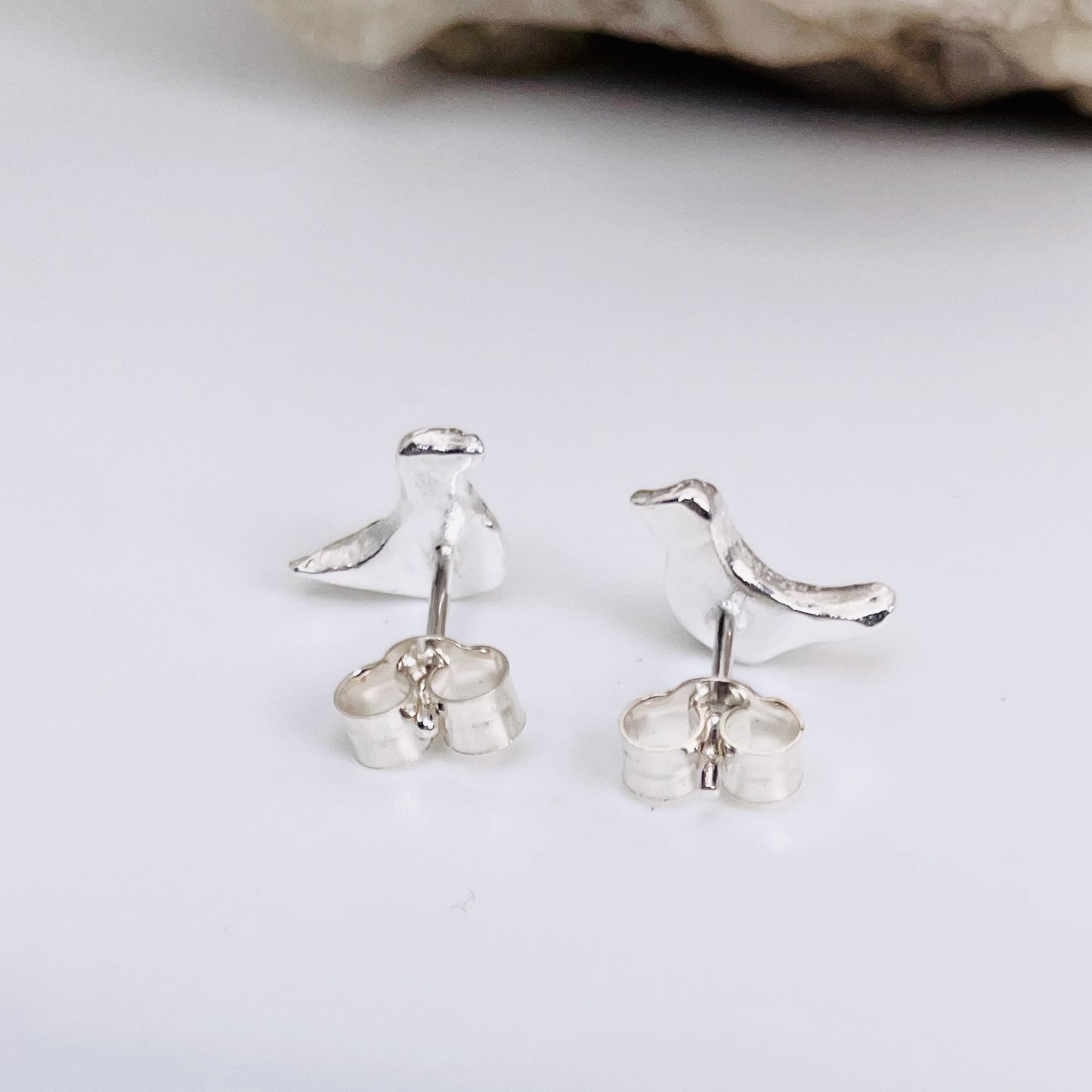 The Dartmoor Moorland Bird Studs are handcrafted in recycled fine silver with recycled sterling silver ear pins and scrolls, each bird is unique. Simple and elegant with a hammered finish, they can be worn everyday for any occasion.