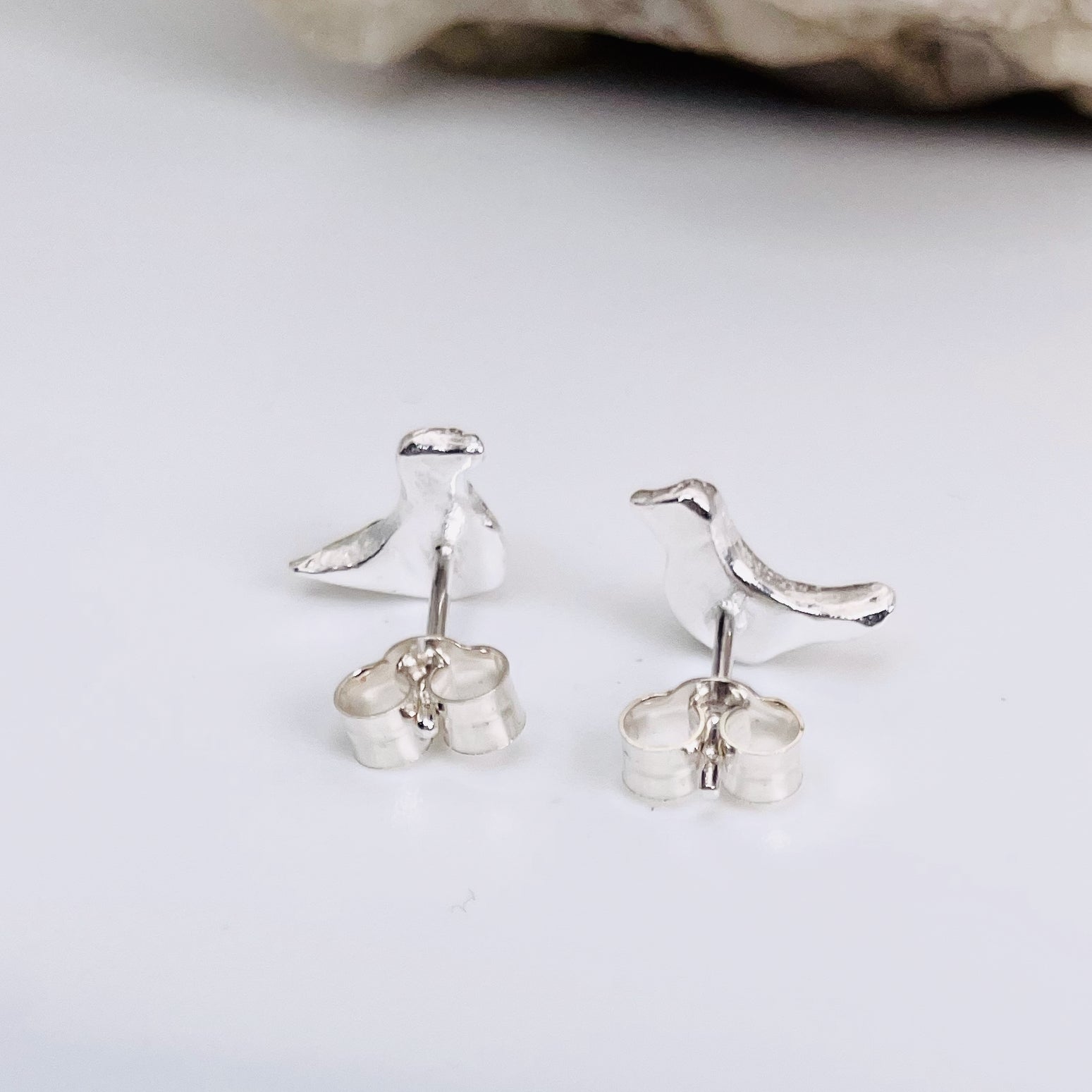 The Dartmoor Moorland Bird Studs are handcrafted in recycled fine silver with recycled sterling silver ear pins and scrolls, each bird is unique. Simple and elegant with a hammered finish, they can be worn everyday for any occasion.