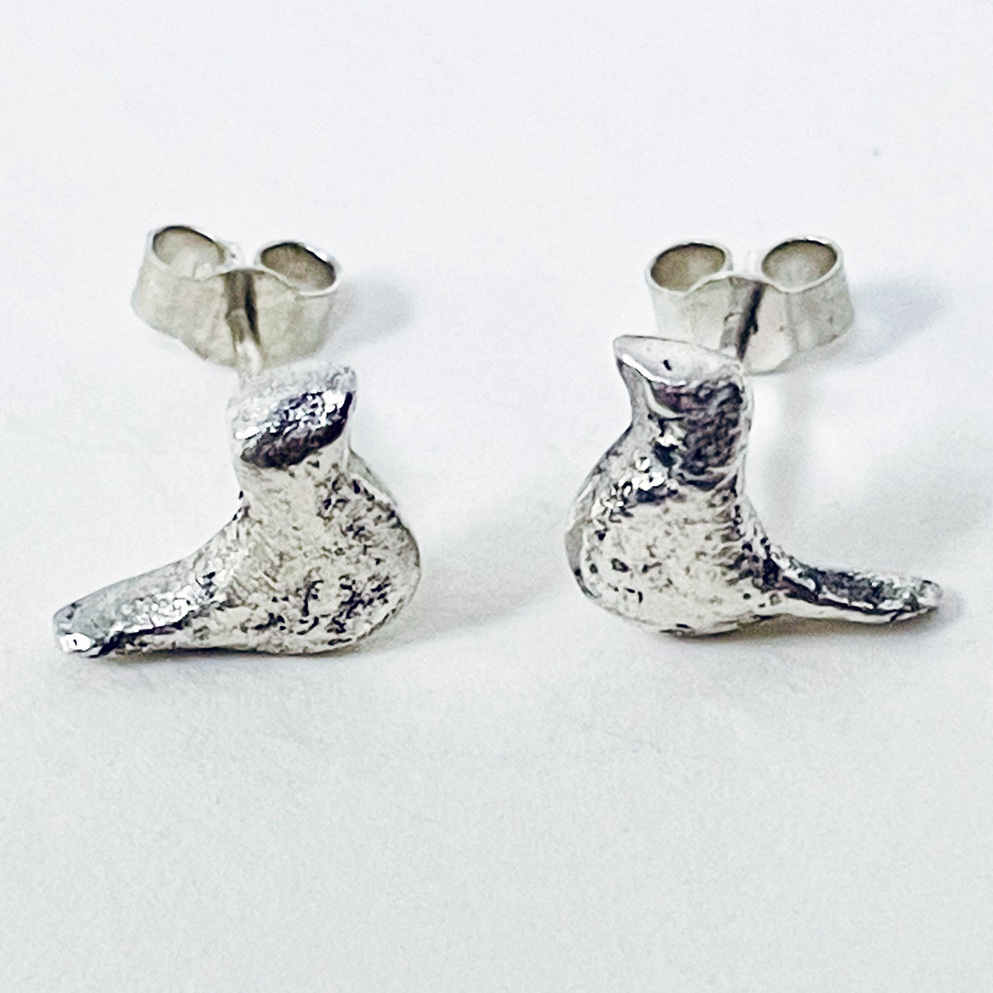 The Dartmoor Moorland Bird Studs are handcrafted in recycled fine silver with recycled sterling silver ear pins and scrolls, each bird is unique. Simple and elegant with a hammered finish, they can be worn everyday for any occasion.