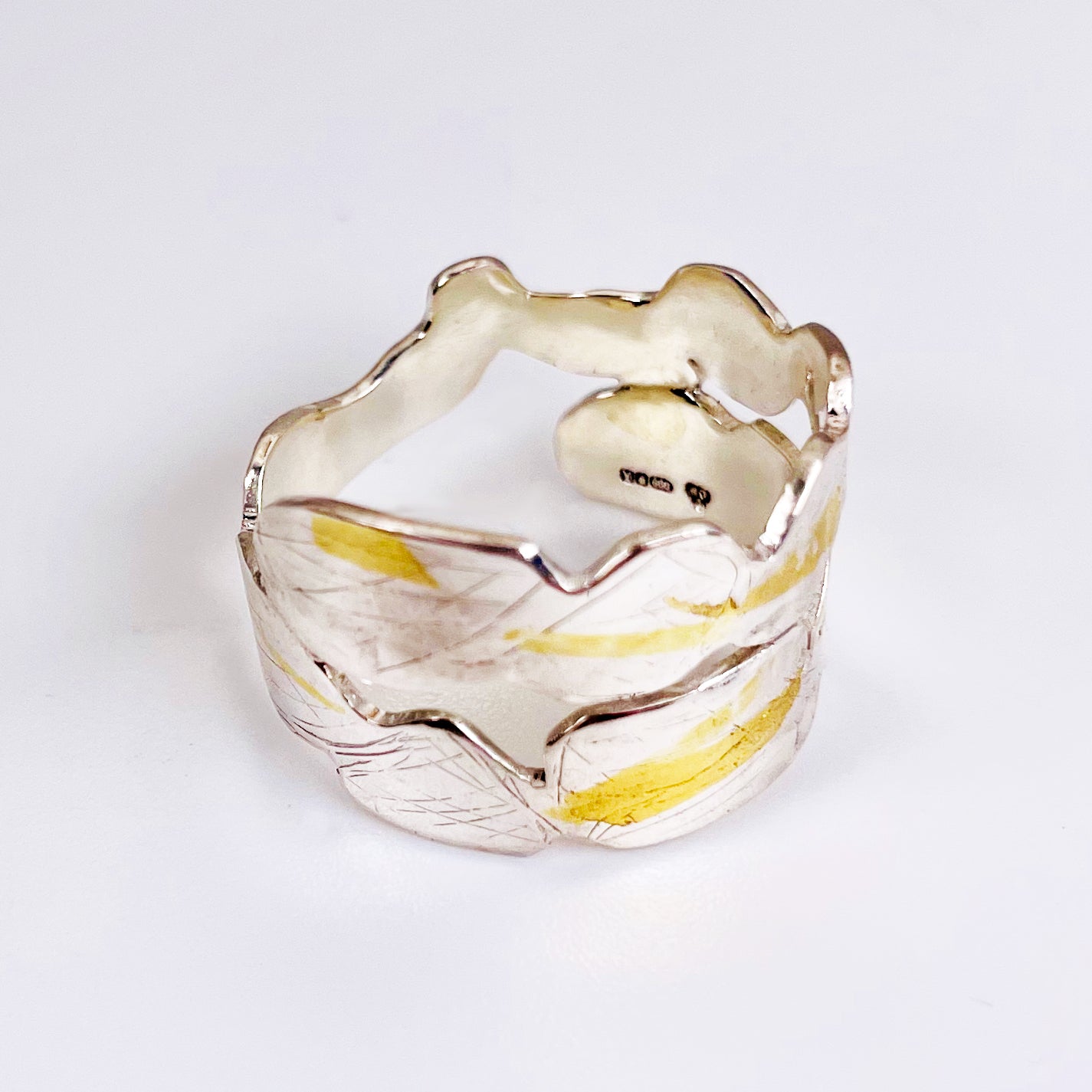 Expanded Skies Bone Tor Ring with 24ct Gold Accents is inspired by the contours and forms of Dartmoor’s Bone Tor, near Widdecombe on the Moor, at sunset. Fine silver with 24ct gold accents.